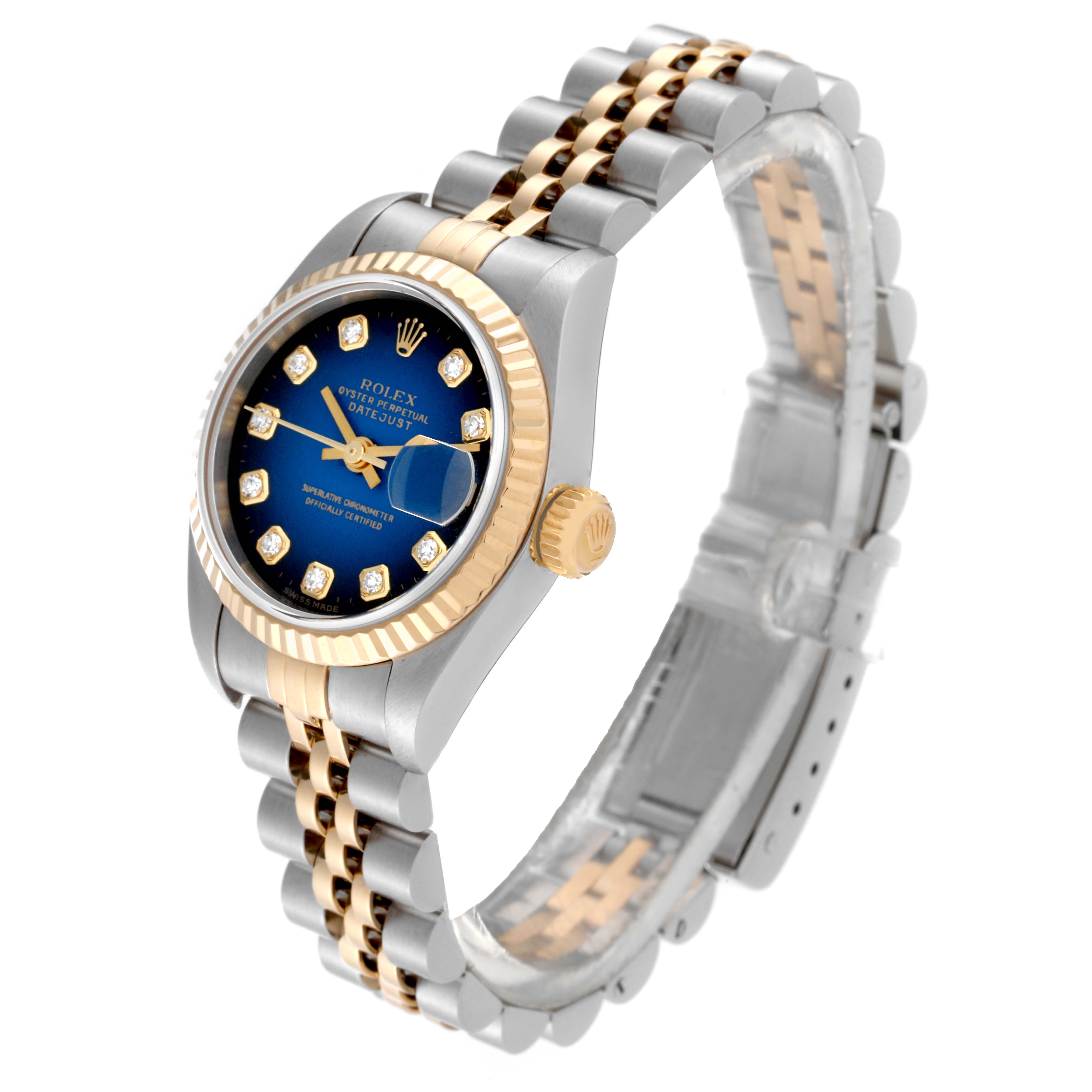 This image shows a Rolex Datejust 79173 Women's Steel and Gold (two tone) Blue Dial 79173 Women's Steel and Gold (two tone) Blue Dial watch at a slight angle, highlighting its two-tone bracelet, fluted bezel, and blue dial.