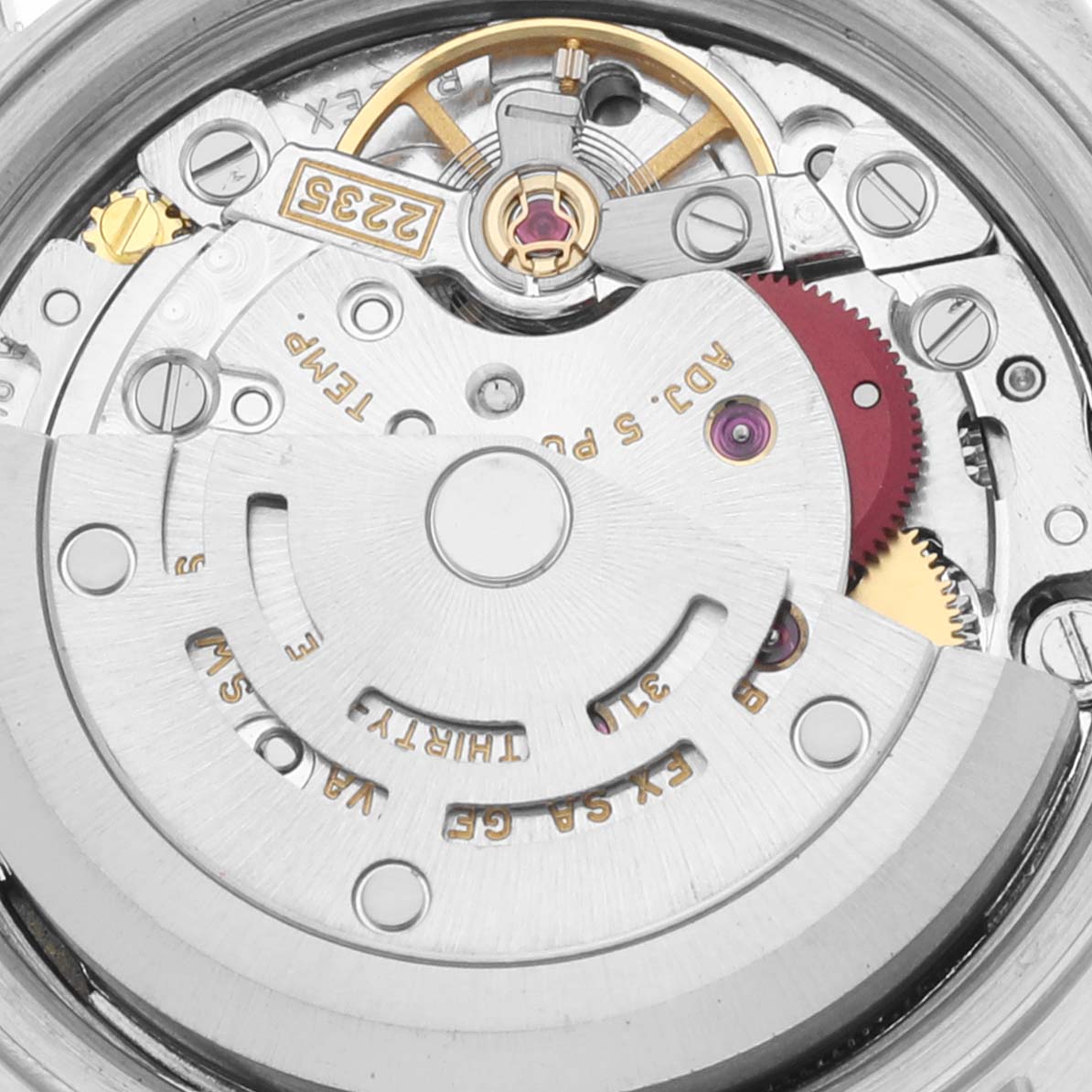 This is a close-up shot of the internal mechanical movement of a Rolex Datejust 79173 Women's Steel and Gold (two tone) Blue Dial 79173 Women's Steel and Gold (two tone) Blue Dial watch, showing intricate gears and components.