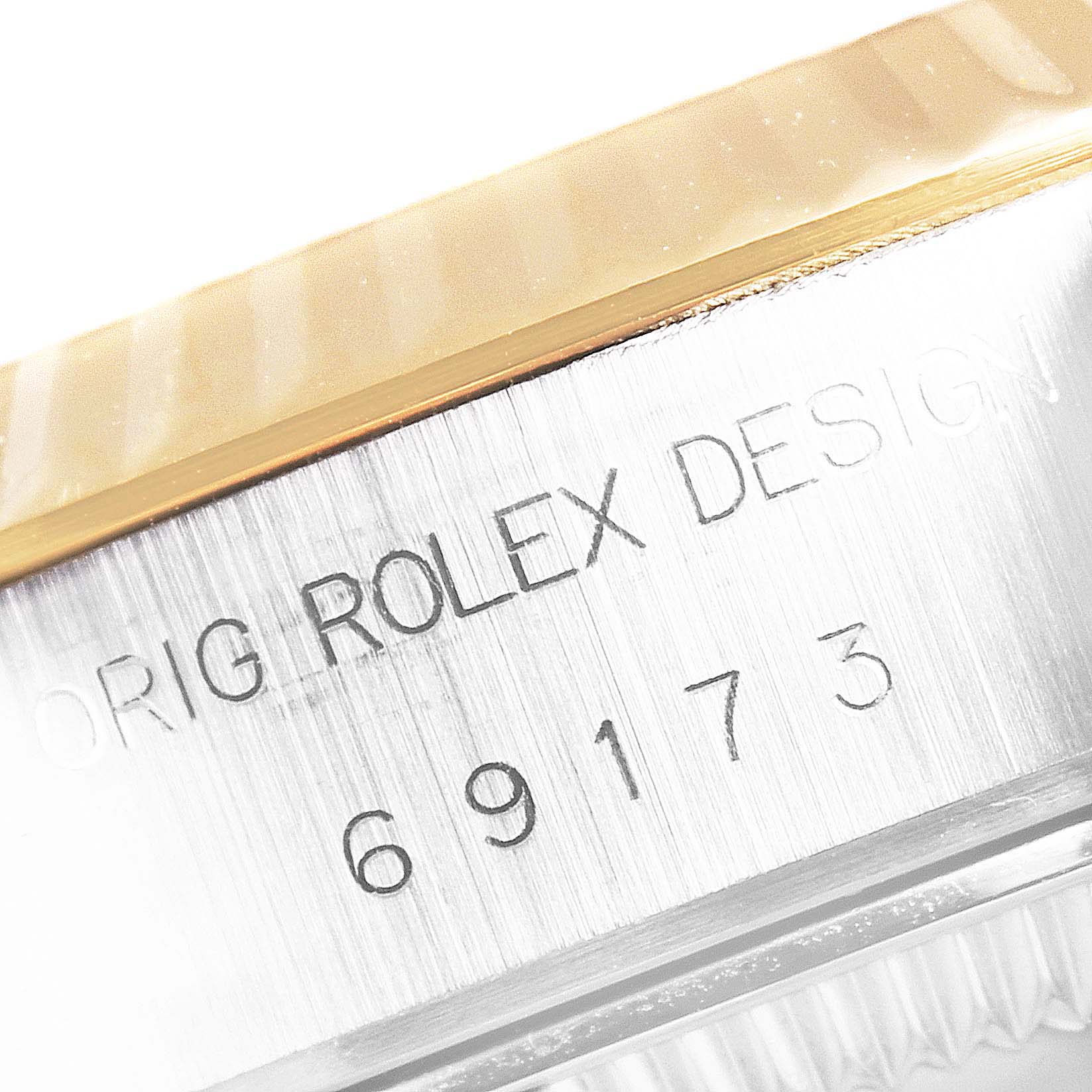 This image shows a close-up of the case back engraving with the model number on a Rolex Datejust 69173 Women
s Steel and Gold (two tone) Champagne Dial 69173 Women
s Steel and Gold (two tone) Champagne Dial watch.