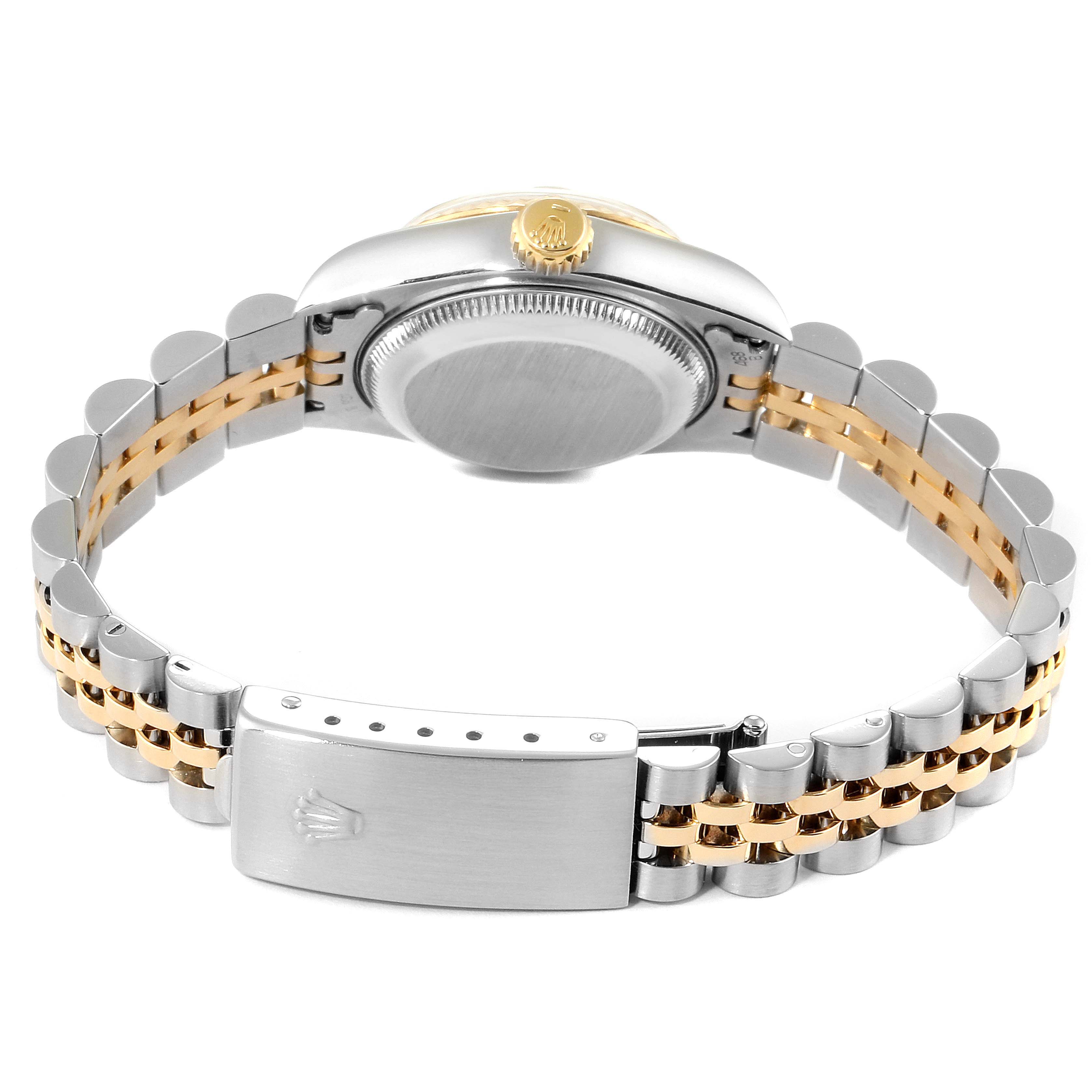 The image shows the back of a Rolex Datejust 69173 Women
s Steel and Gold (two tone) White Dial 69173 Women
s Steel and Gold (two tone) White Dial watch, highlighting the case back and two-toned bracelet.