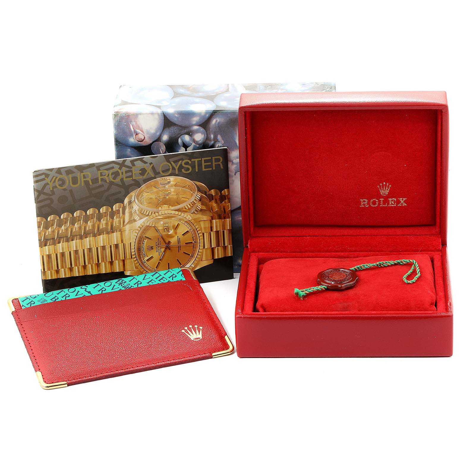 The image shows a Rolex Datejust 79173 Women's Steel and Gold (two tone) Champagne Dial 79173 Women's Steel and Gold (two tone) Champagne Dial watch box, card holder, booklet, and a tag, all from an angled perspective.