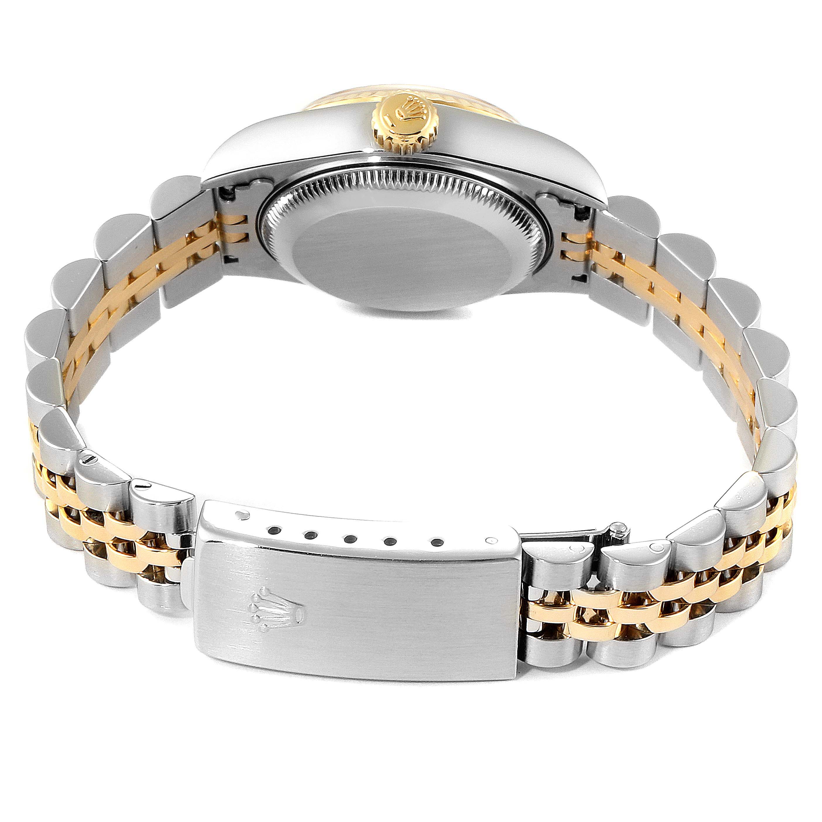 The image shows the back of the Rolex Datejust 79173 Women's Steel and Gold (two tone) Champagne Dial 79173 Women's Steel and Gold (two tone) Champagne Dial watch, highlighting the bracelet and clasp with a focus on the crown and case back.