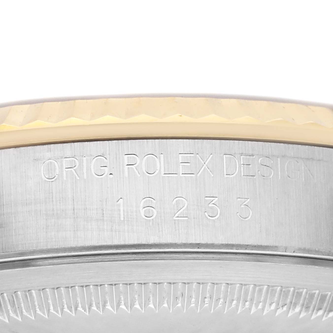 This image shows a close-up of the side of the case of a Rolex Datejust 16233 Men
s Steel and Gold (two tone) Champagne Dial 16233 Men
s Steel and Gold (two tone) Champagne Dial watch, highlighting the model number and design engraving.