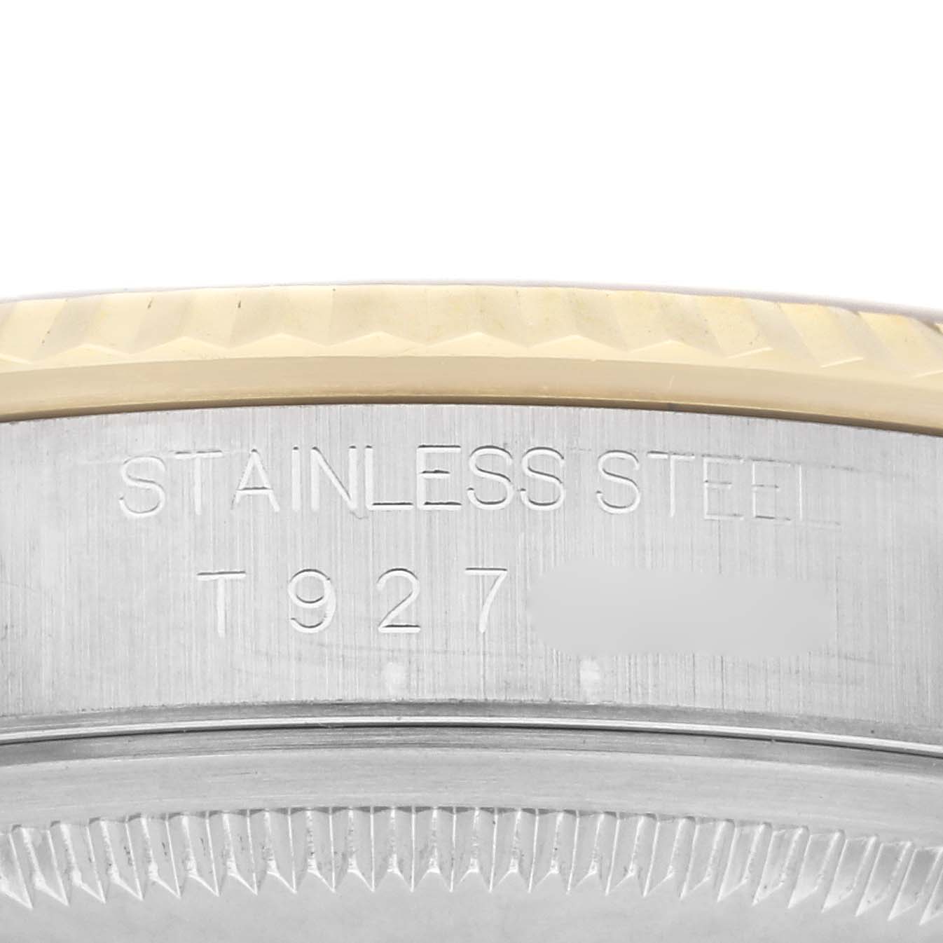 This image shows a close-up of the case back edge of a Rolex Datejust 16233 Men
s Steel and Gold (two tone) Champagne Dial 16233 Men
s Steel and Gold (two tone) Champagne Dial watch made of stainless steel.