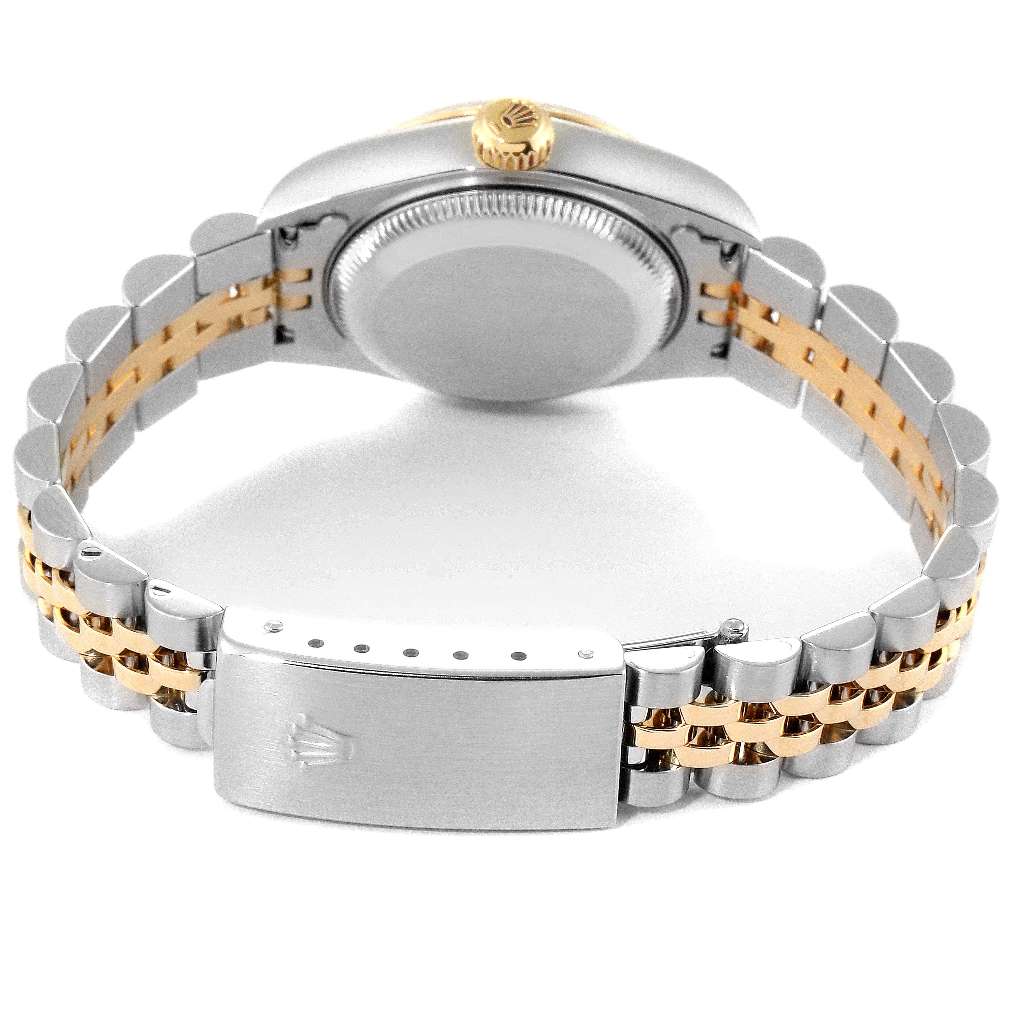 The image shows the back view of a Rolex Datejust 79173 Women
s Steel and Gold (two tone) White Dial 79173 Women
s Steel and Gold (two tone) White Dial watch, highlighting its clasp, case back, and two-tone bracelet.