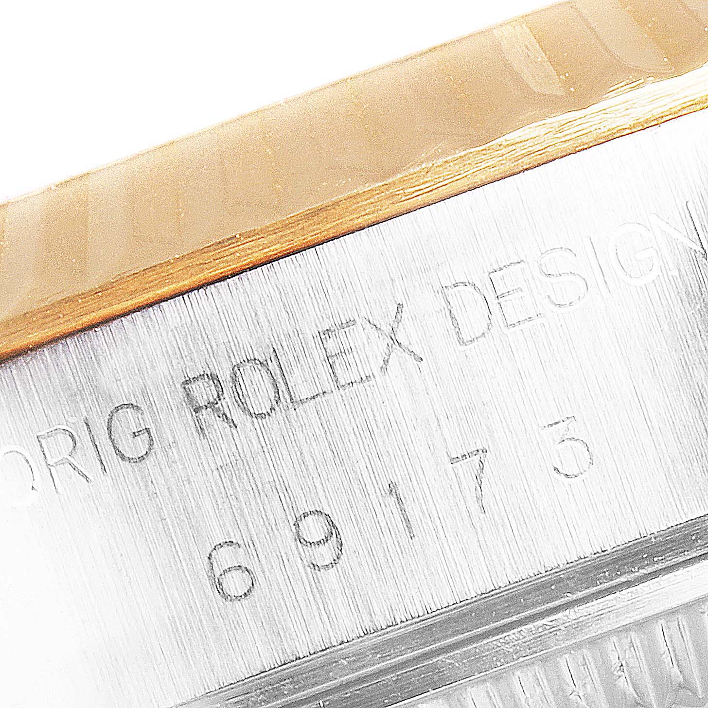 The image shows a close-up of the engraved model number on the case side of a Rolex Datejust 79173 Women
s Steel and Gold (two tone) Champagne Dial 79173 Women
s Steel and Gold (two tone) Champagne Dial watch.