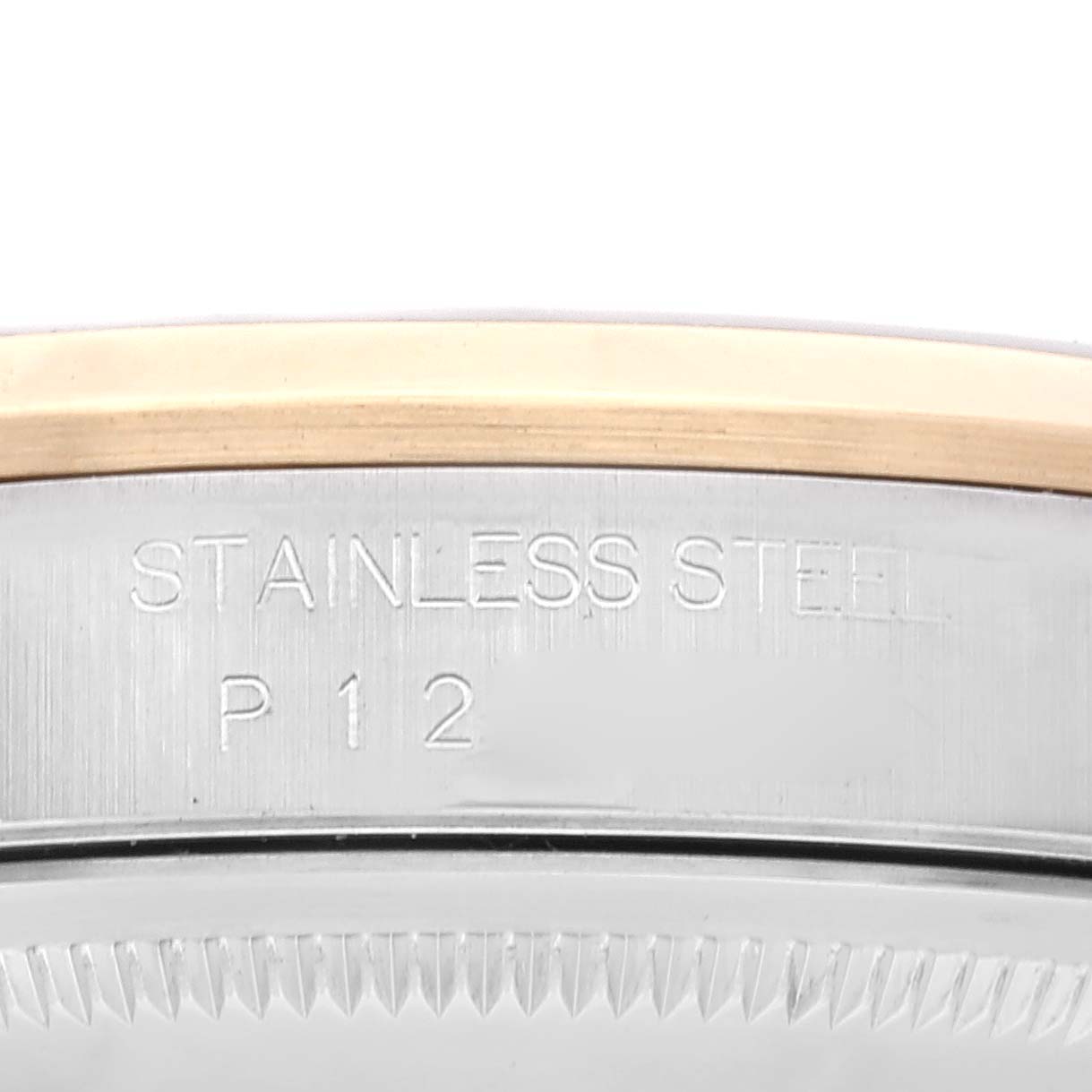 The image shows an engraved part of a Rolex Datejust 16203 Men's Steel and Gold (two tone) Black Dial 16203 Men's Steel and Gold (two tone) Black Dial watch model, highlighting "Stainless Steel" and the marking "P 1 2."