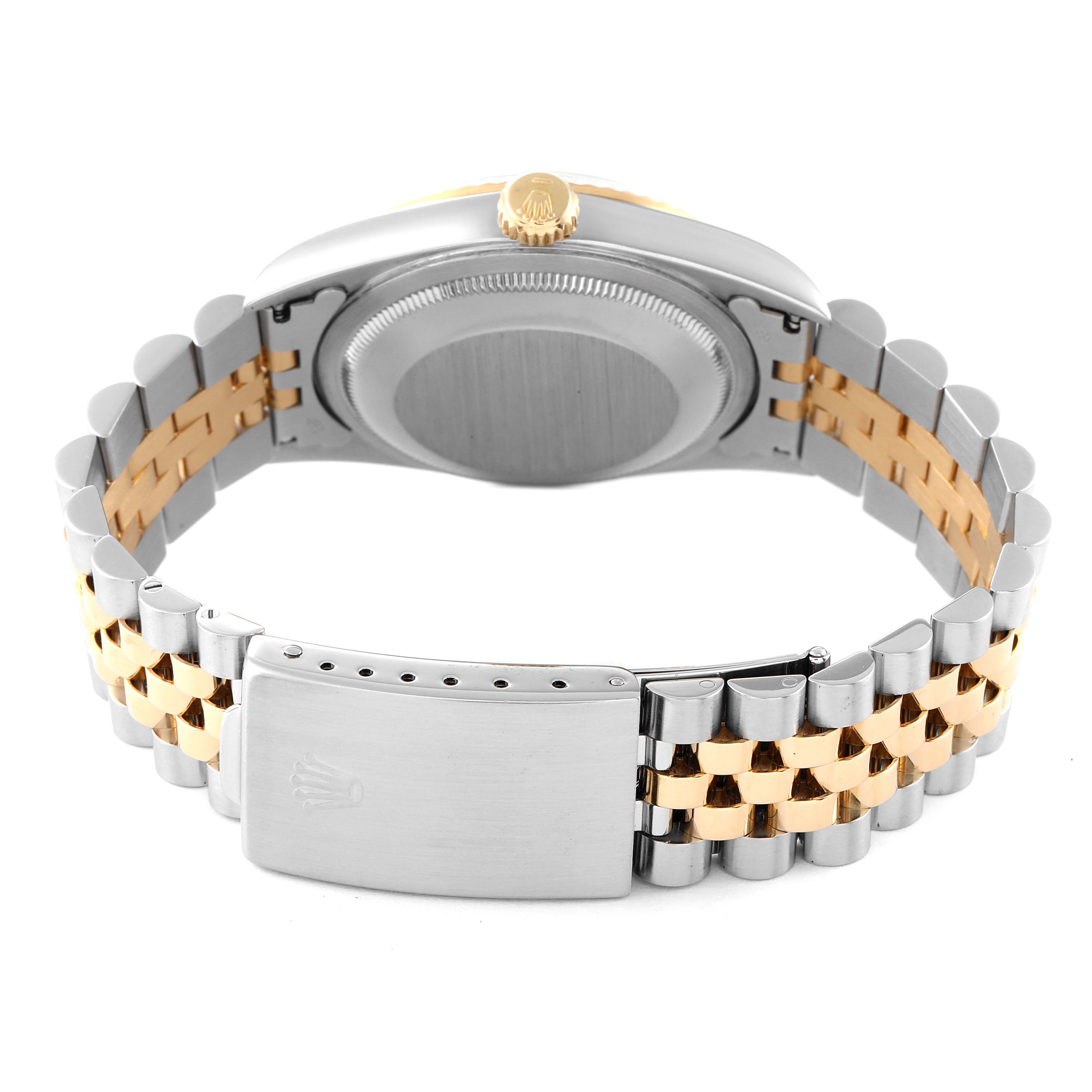 The image shows the back side of a Rolex Datejust 16233 Men
s Steel and Gold (two tone) Grey Dial 16233 Men
s Steel and Gold (two tone) Grey Dial watch, showcasing its two-tone Jubilee bracelet and clasp.