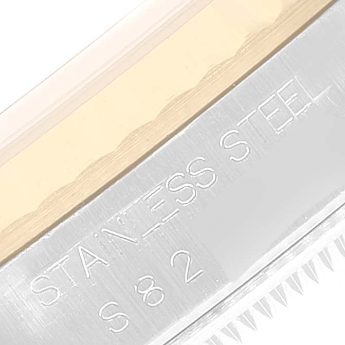 This is a close-up of the side detailing and engravings on the bezel of a Rolex Datejust 16233 Men
s Steel and Gold (two tone) Grey Dial 16233 Men
s Steel and Gold (two tone) Grey Dial watch.