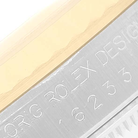 The image shows a close-up angle of the engraved case back and bezel of the Rolex Datejust 16233 Men
s Steel and Gold (two tone) Grey Dial 16233 Men
s Steel and Gold (two tone) Grey Dial watch.