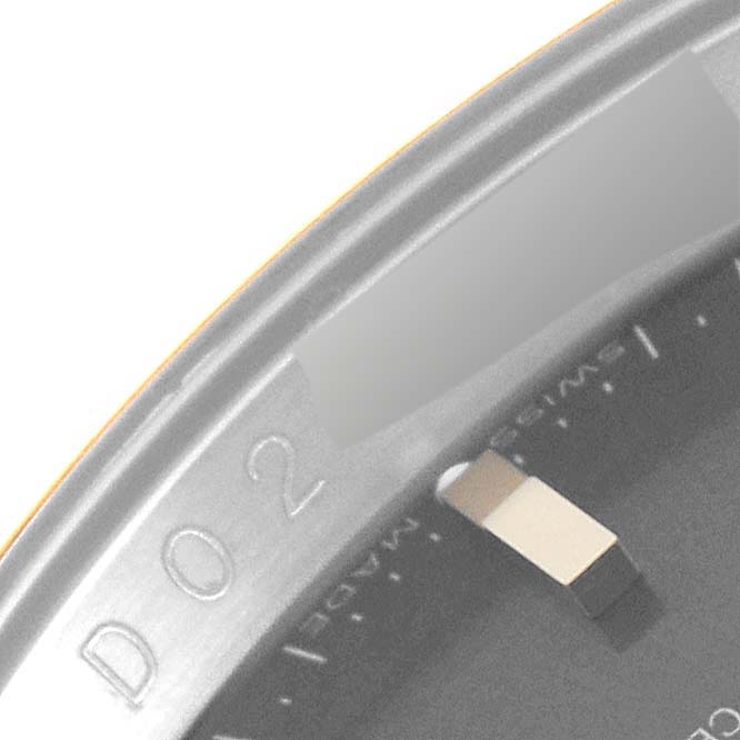 This image shows a close-up view of the bezel and part of the dial of the Rolex Turn-o-Graph 116263 Men's Steel and Gold (two tone) Grey Dial 116263 Men's Steel and Gold (two tone) Grey Dial model.