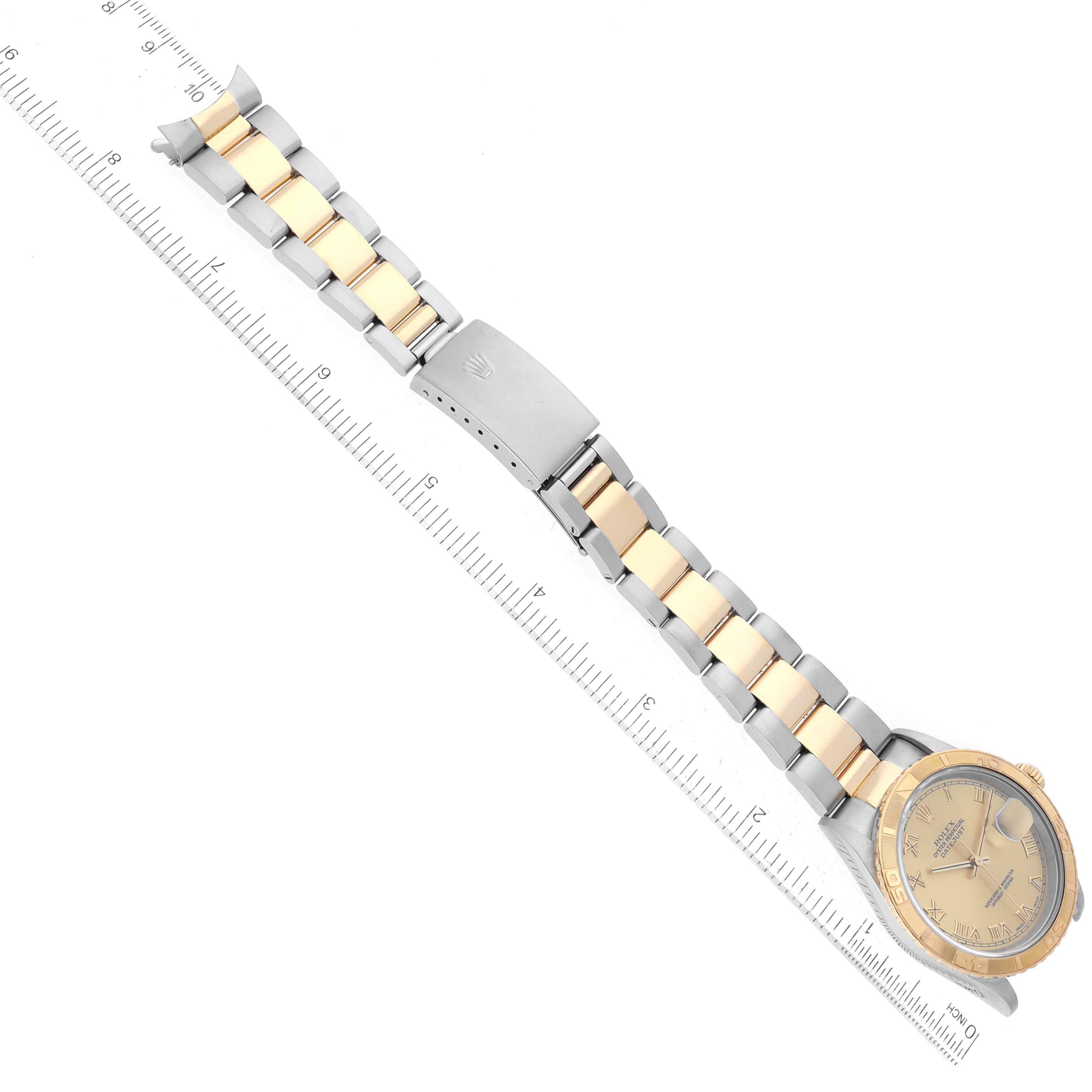 This image shows a Rolex Turn-o-Graph 16263 Men's Steel and Gold (two tone) Champagne Dial 16263 Men's Steel and Gold (two tone) Champagne Dial watch laid flat, displaying its dial, case, and two-tone bracelet next to a ruler.