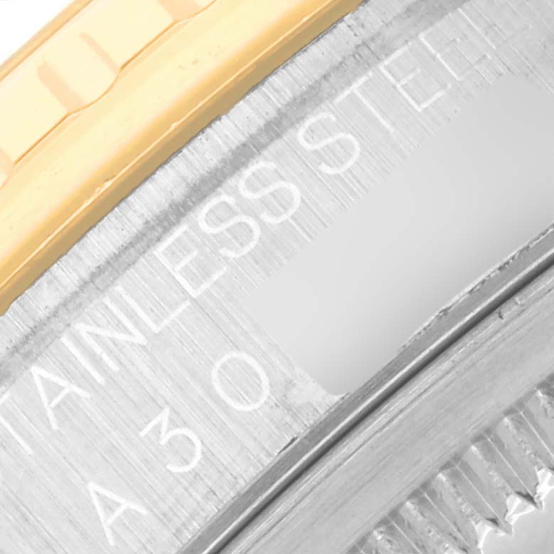 The image shows a close-up of the side of the bezel and part of the case of a Rolex Turn-o-Graph 16263 Men's Steel and Gold (two tone) Champagne Dial 16263 Men's Steel and Gold (two tone) Champagne Dial watch, highlighting the "STAINLESS STEEL" engraving.