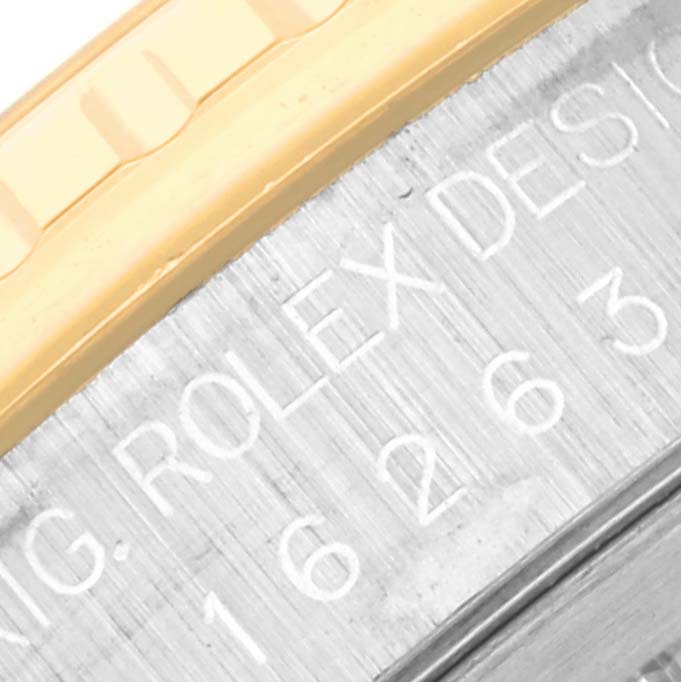 This image shows a close-up of the engraved side of the Rolex Turn-o-Graph 16263 Men's Steel and Gold (two tone) Champagne Dial 16263 Men's Steel and Gold (two tone) Champagne Dial model, highlighting the bezel and part of the case.