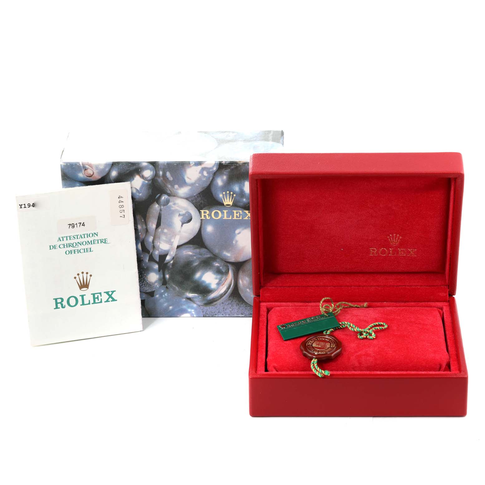 This image shows a Rolex Datejust 79174 Women's Stainless Steel Black Dial 79174 Women's Stainless Steel Black Dial packaging, including a red box, certificate, and tags from a frontal angle.