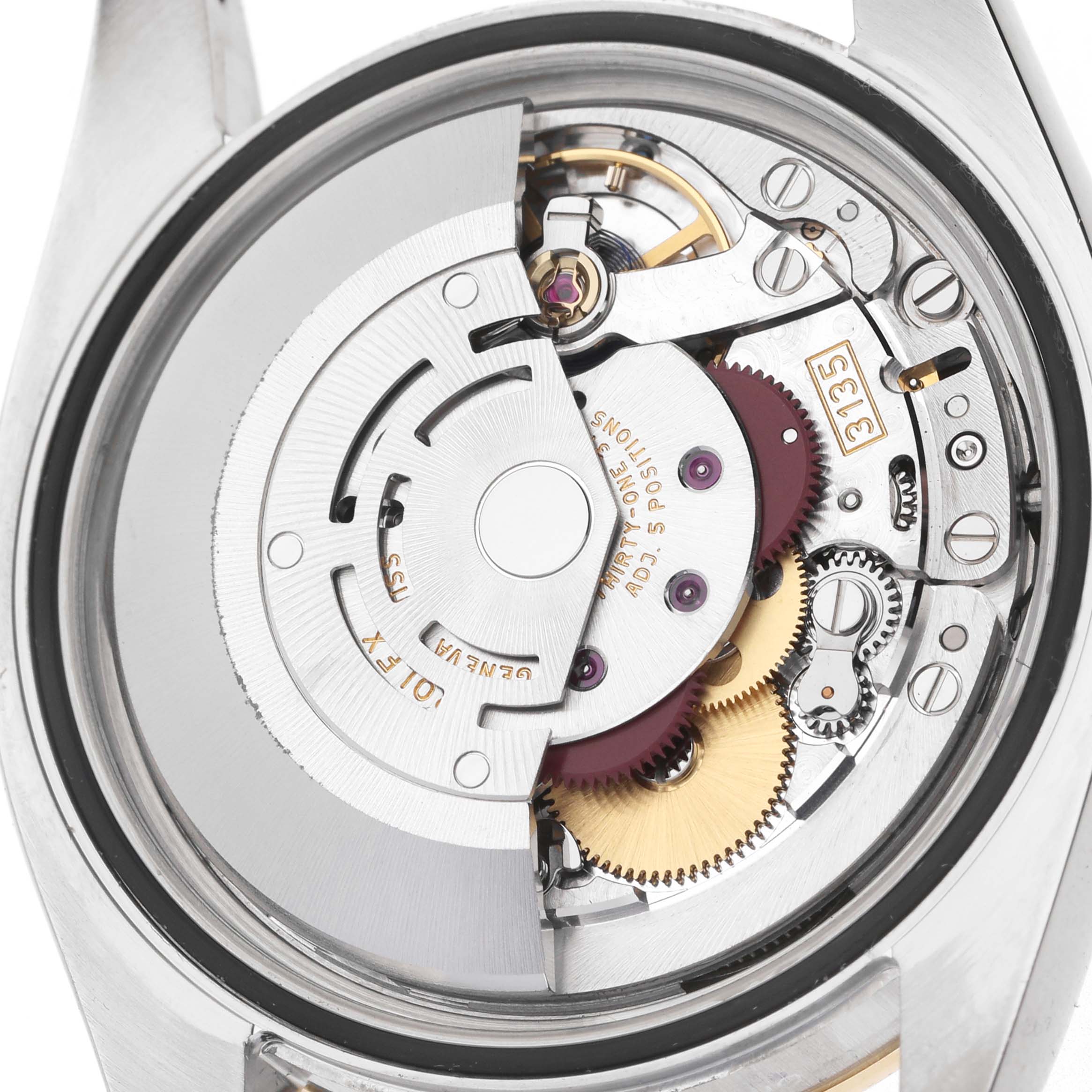 The image shows the movement of a Rolex Datejust 116243 Men's Steel and Gold (two tone) Champagne Dial, featuring gears and the rotor, viewed from the back.