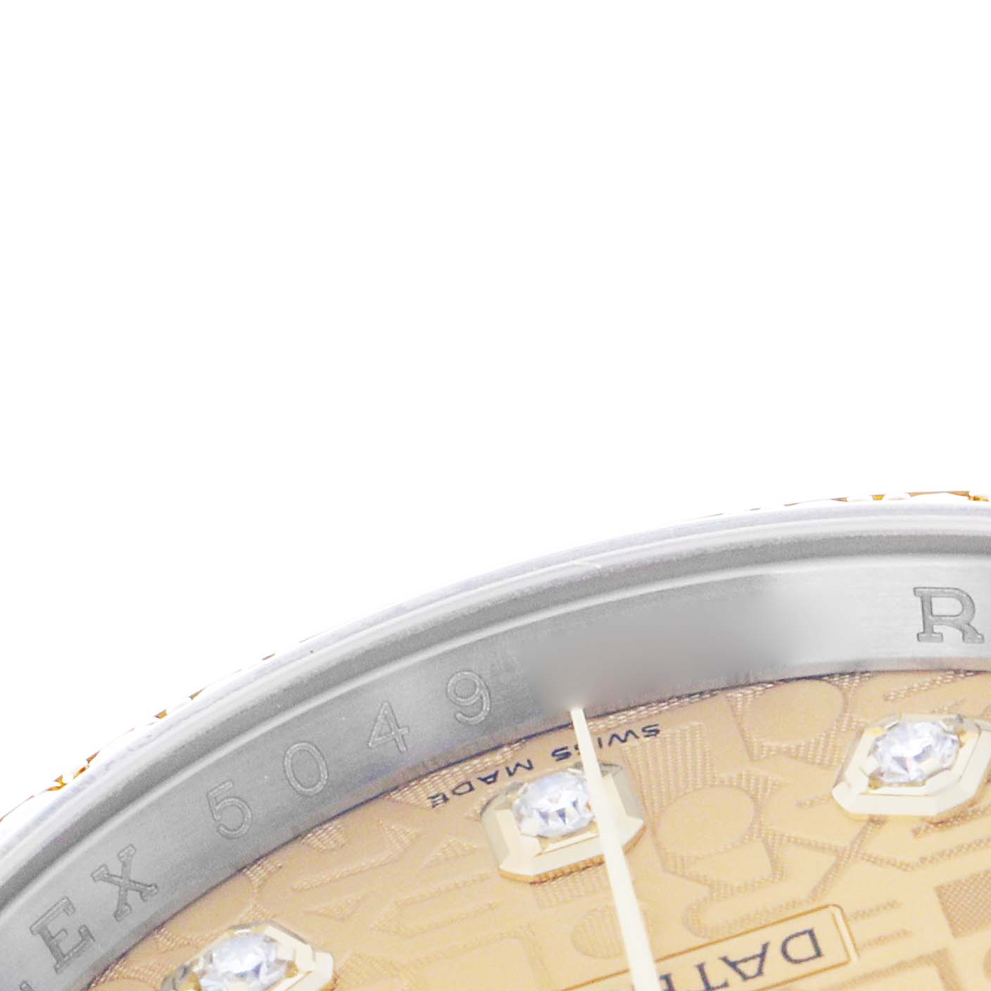 The image shows a close-up of the dial and bezel edge of a Rolex Datejust 116243 Men's Steel and Gold (two tone) Champagne Dial, showcasing diamond markers and part of the engravings.