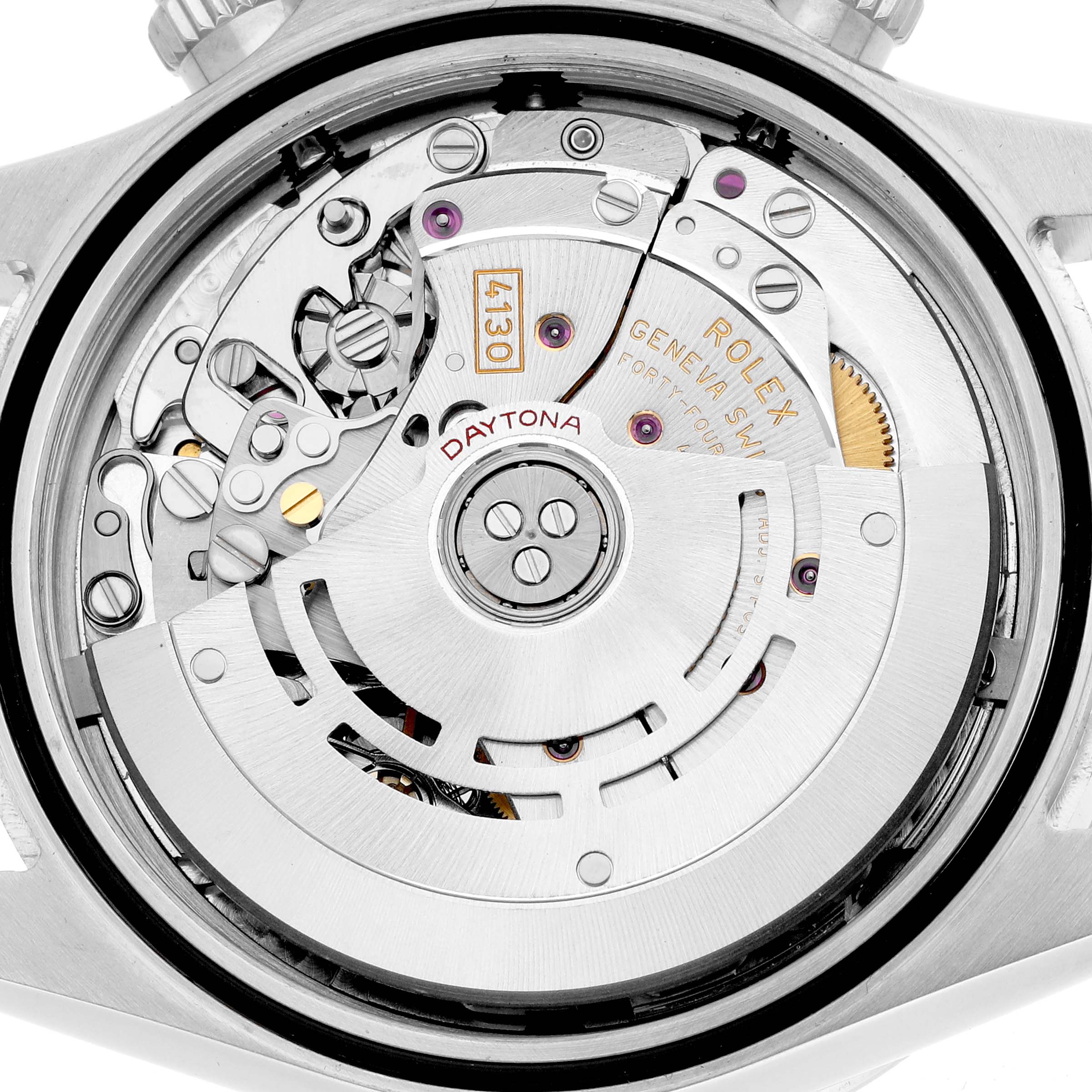 The image shows the movement and rotor of a Rolex Daytona 116520 Men's Stainless Steel White Dial watch from a rear angle.
