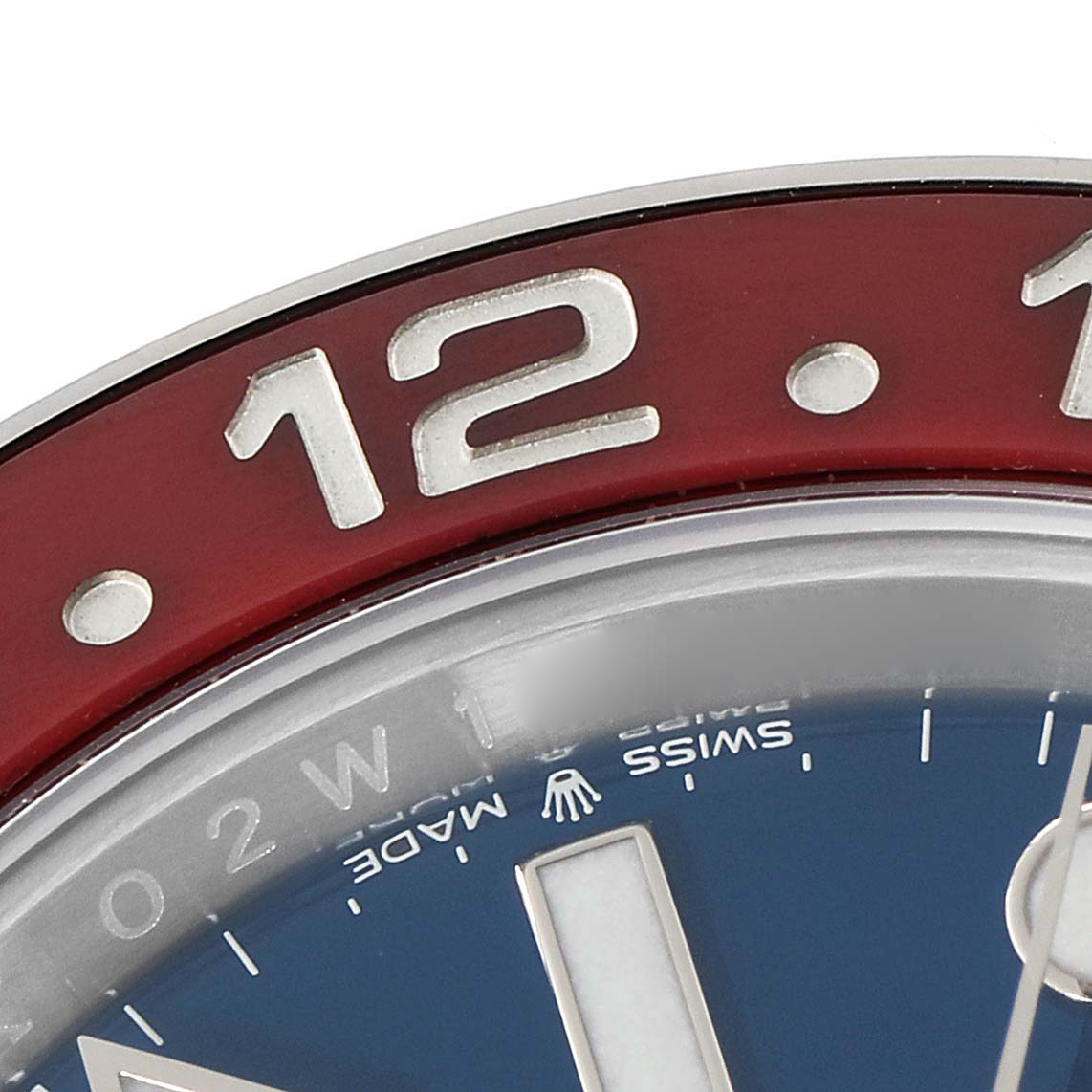 The image shows a close-up of the red and blue bezel and part of the dial of a Rolex GMT-Master 126719 Men
s Stainless Steel Blue Dial 126719 Men
s Stainless Steel Blue Dial watch.