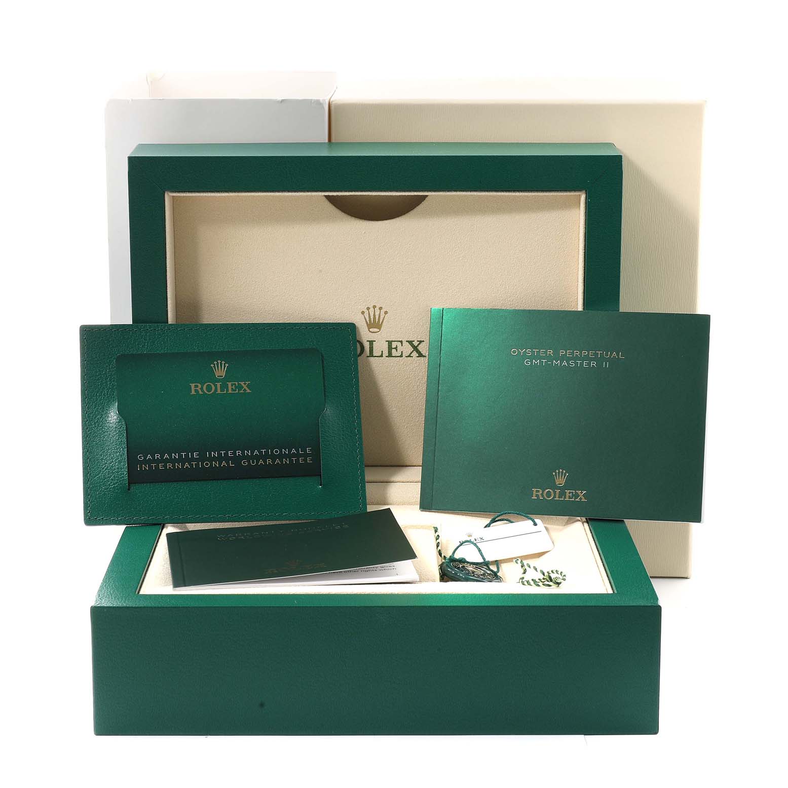 The image shows the packaging, guarantee card, and booklet for a Rolex GMT-Master 126719 Men
s Stainless Steel Blue Dial 126719 Men
s Stainless Steel Blue Dial II watch.