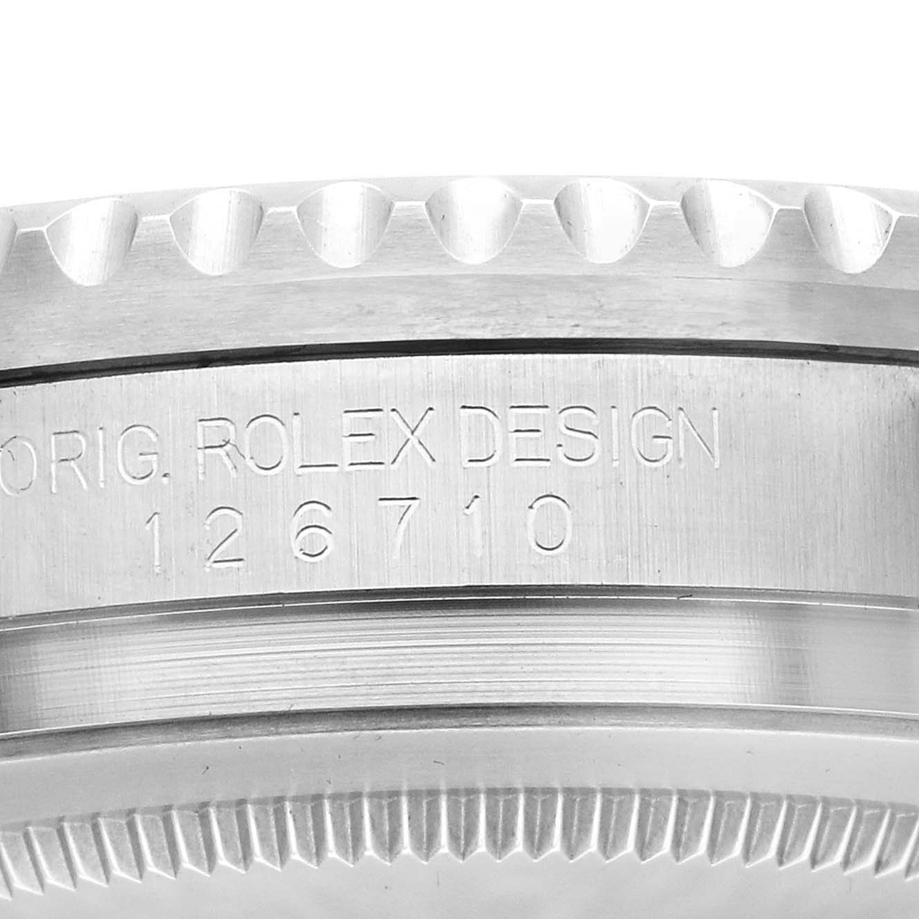 The image shows a close-up of the side of a Rolex GMT-Master 126710 Men
s Stainless Steel Black Dial, displaying the bezel and "Rolex Design 126710" engraving.