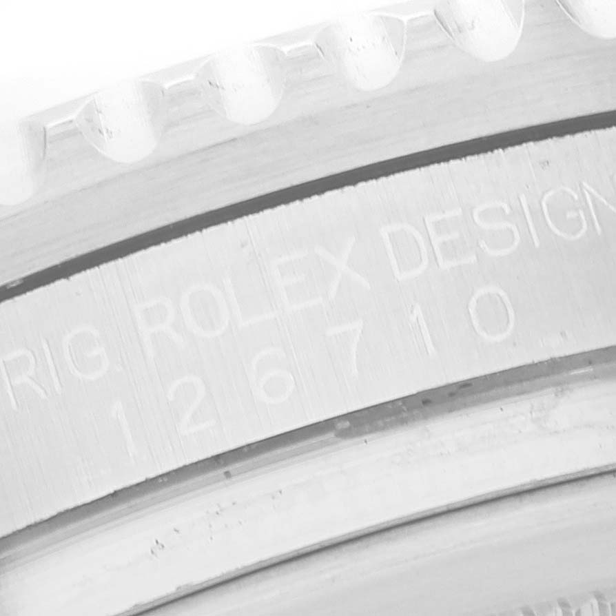The image shows a close-up of the case engraving on a Rolex GMT-Master 126710 Men
s Stainless Steel Black Dial 126710 Men
s Stainless Steel Black Dial, displaying the model number 126710.
