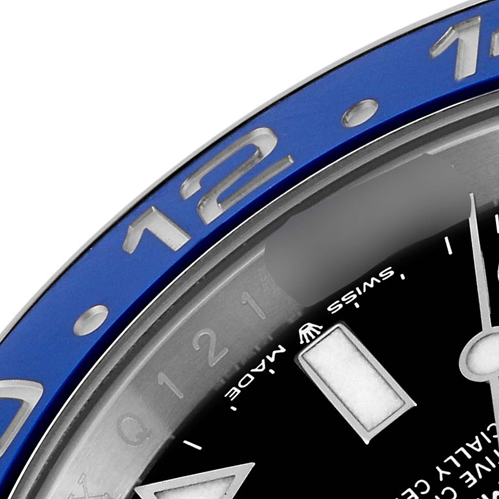 This close-up image of the Rolex GMT-Master 126710 Men
s Stainless Steel Black Dial 126710 Men
s Stainless Steel Black Dial watch shows part of the bezel, hour markers, and a portion of the dial.