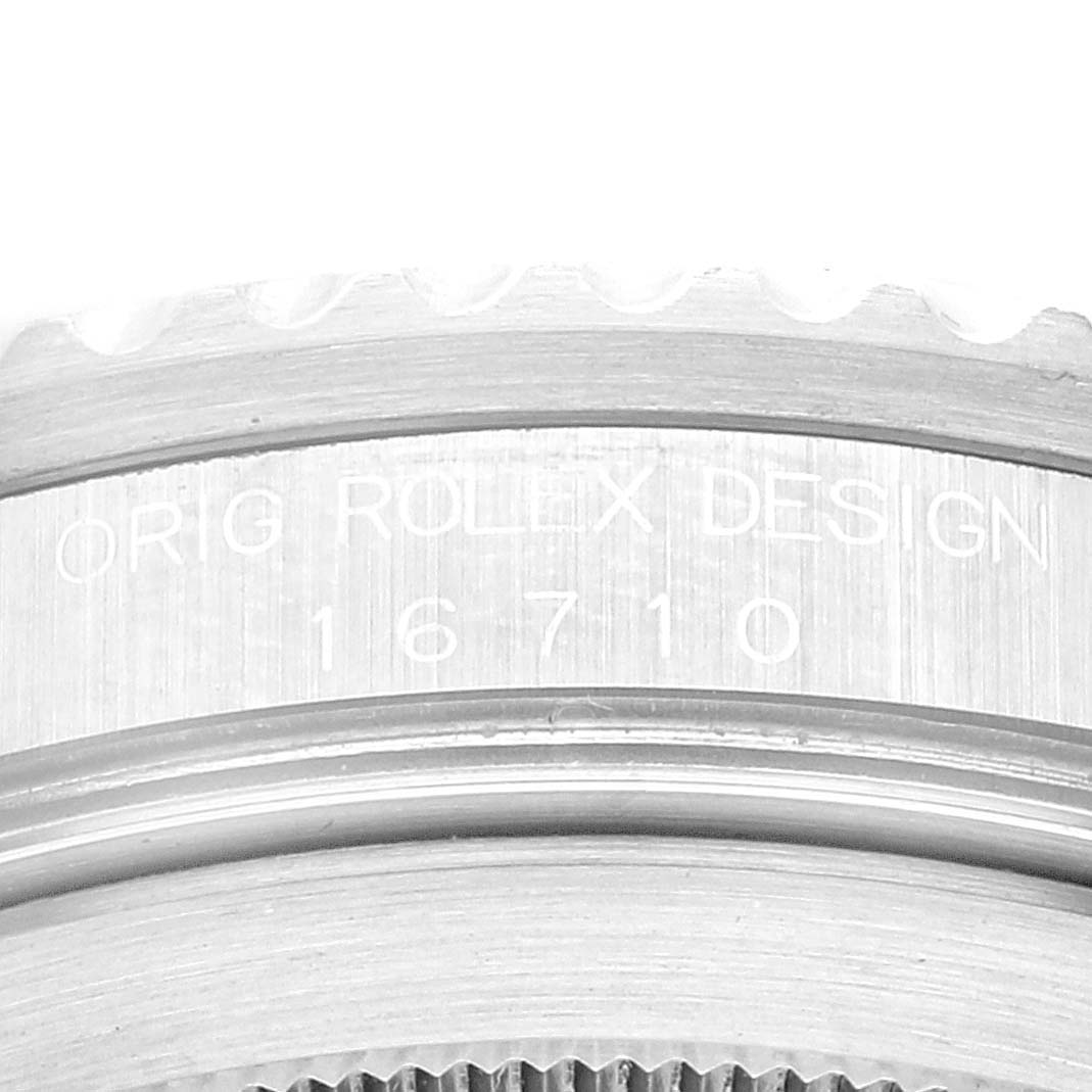 This close-up angle shows the engraved serial number "16710" and "ORIG ROLEX DESIGN" on the case of a Rolex GMT-Master 16710 Men
s Stainless Steel Black Dial 16710 Men
s Stainless Steel Black Dial watch.