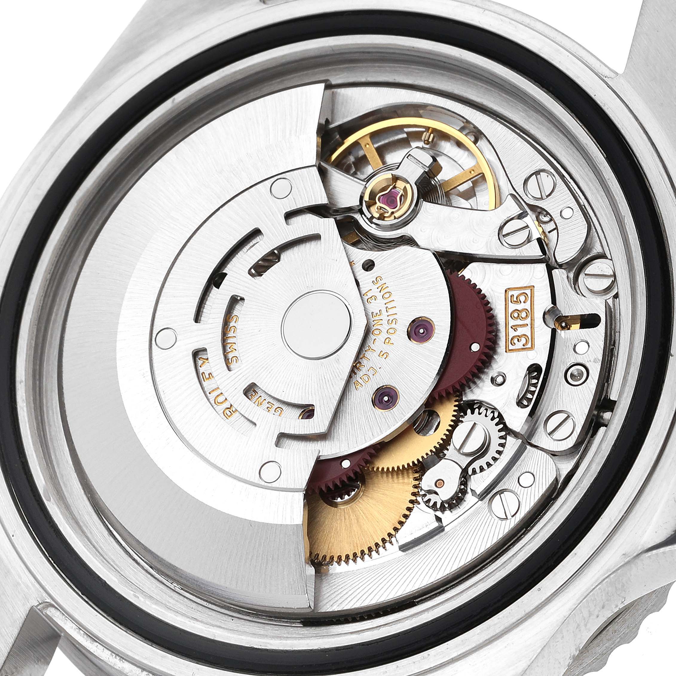 The image shows the internal mechanical movement of a Rolex GMT-Master 16710 Men
s Stainless Steel Black Dial 16710 Men
s Stainless Steel Black Dial watch from the back, highlighting gears and rotor.