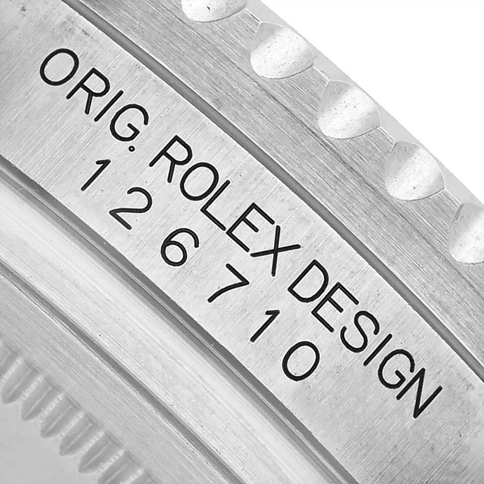 The image shows a close-up of the side engraving on a Rolex GMT-Master M126710BLNR-0003 Men's Stainless Steel Black Dial, highlighting the model number "126710."