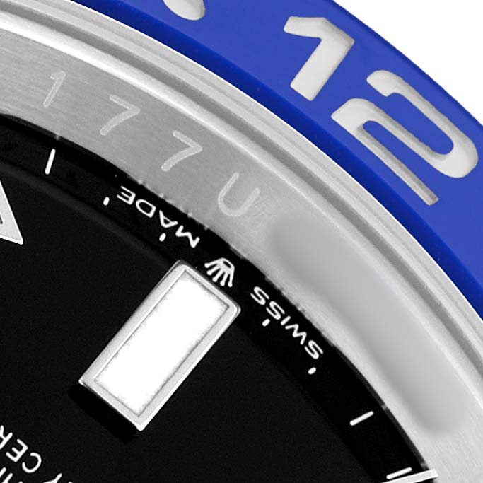 The image shows the bezel and part of the dial with an hour marker of the Rolex GMT-Master M126710BLNR-0003 Men's Stainless Steel Black Dial, focusing on the "12" and "17" indices.