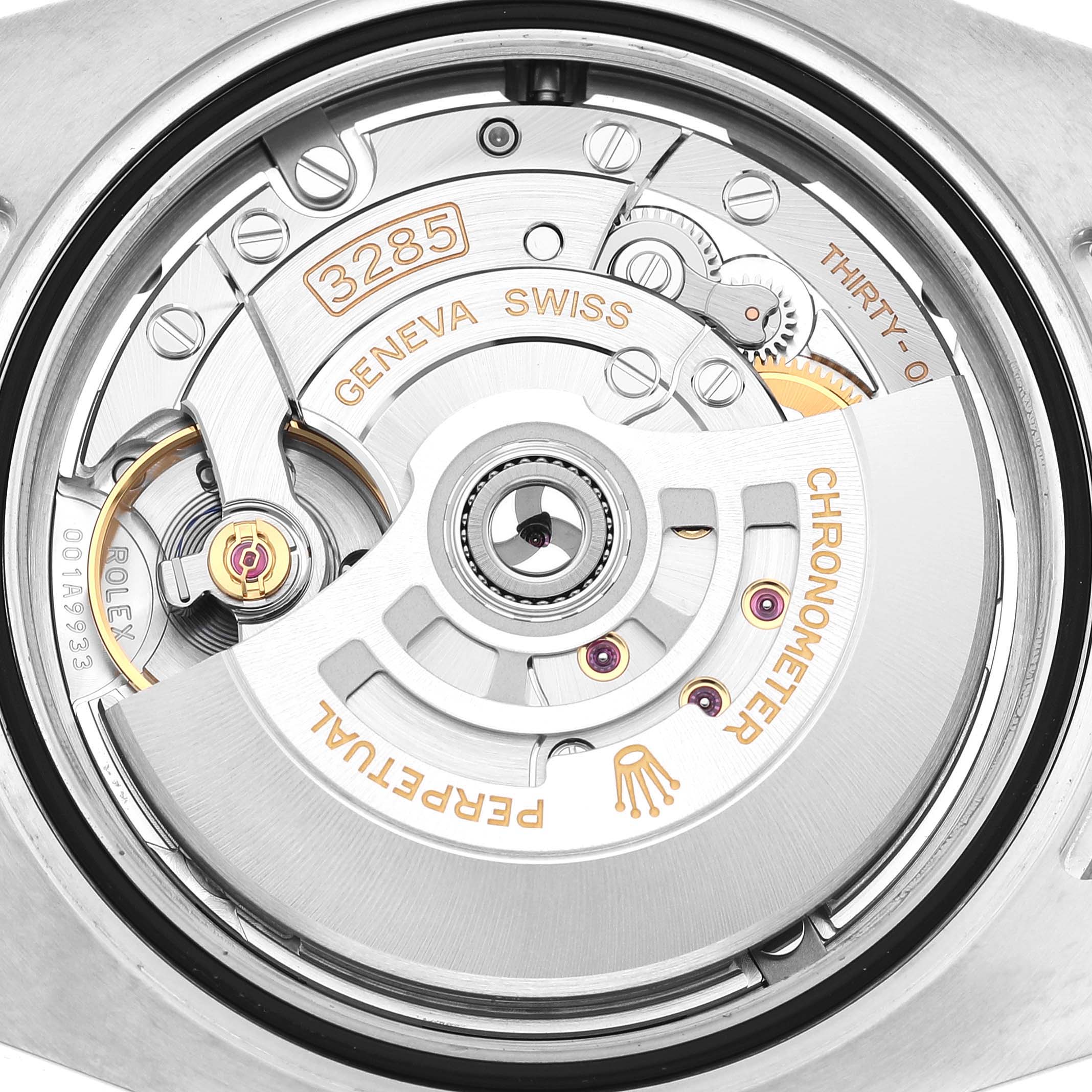 The image shows the movement of a Rolex GMT-Master M126710BLNR-0003 Men's Stainless Steel Black Dial, focusing on the automatic rotor and gear components from a top-down angle.