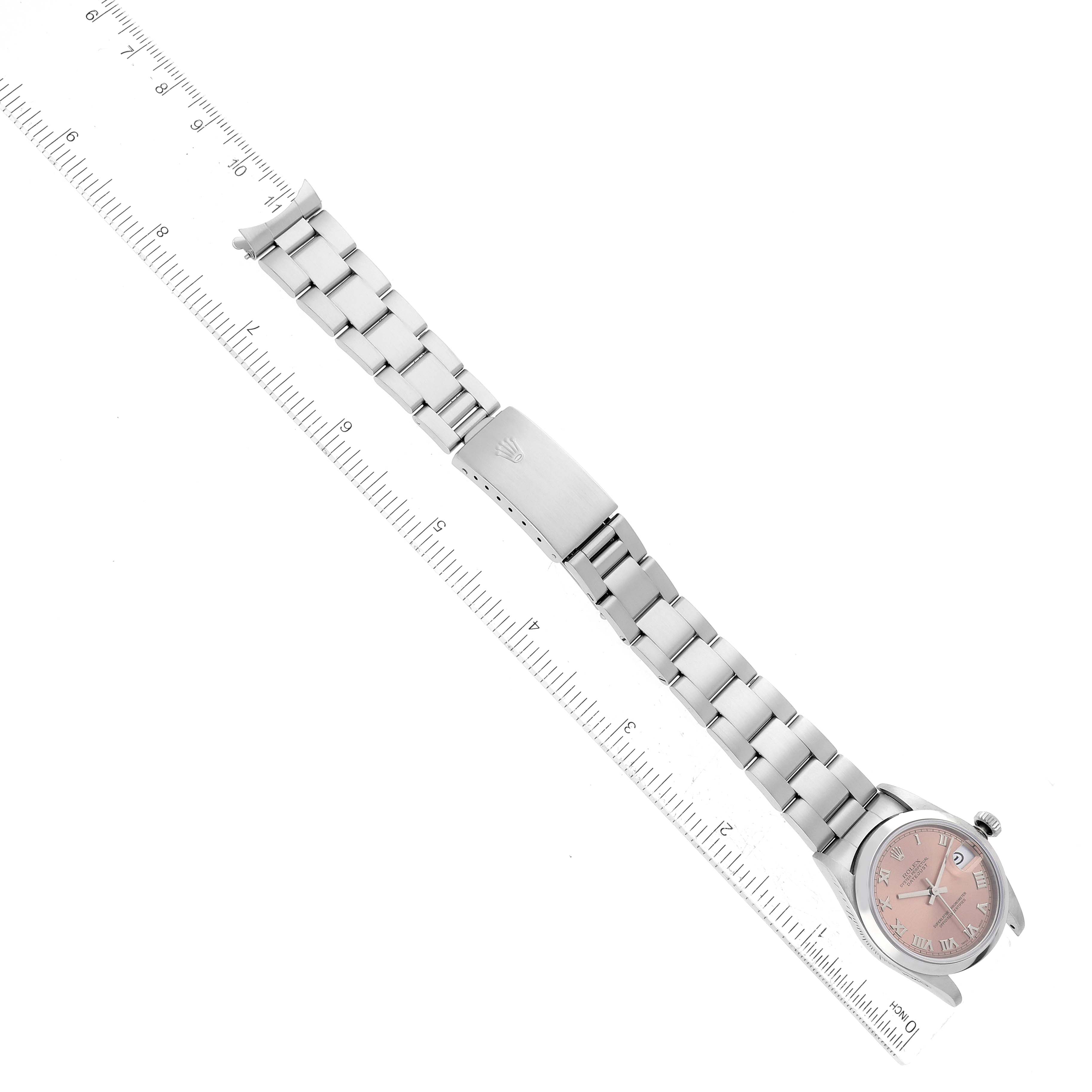 This image shows a Rolex Mid-Size 68240 Women's Stainless Steel Pink Dial 68240 Women's Stainless Steel Pink Dial watch laid flat with the bracelet fully extended and a ruler alongside for size reference.