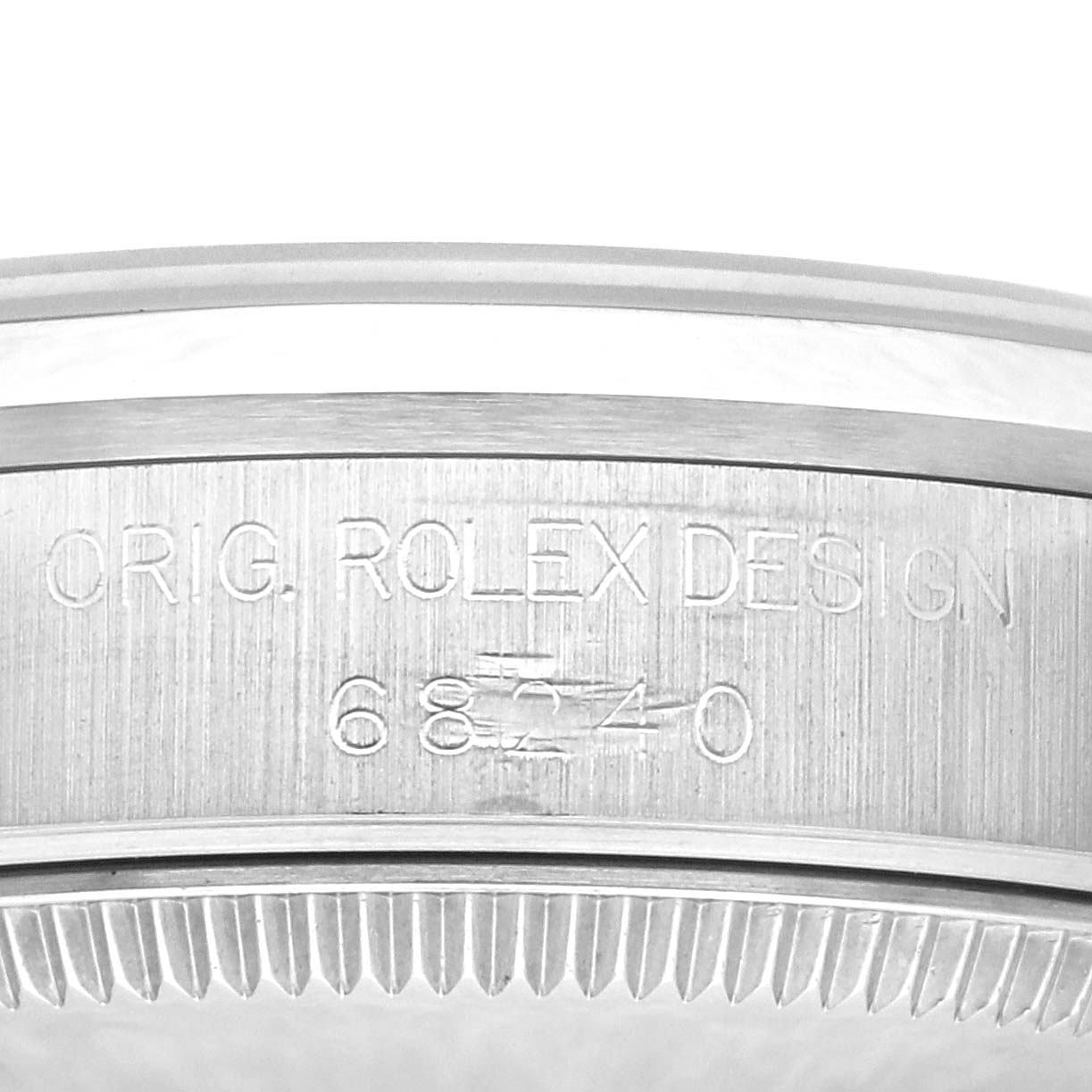 The photo shows a close-up of the side of a Mid-Size Rolex watch, featuring engraving that reads "ORIG. ROLEX DESIGN 68240."
