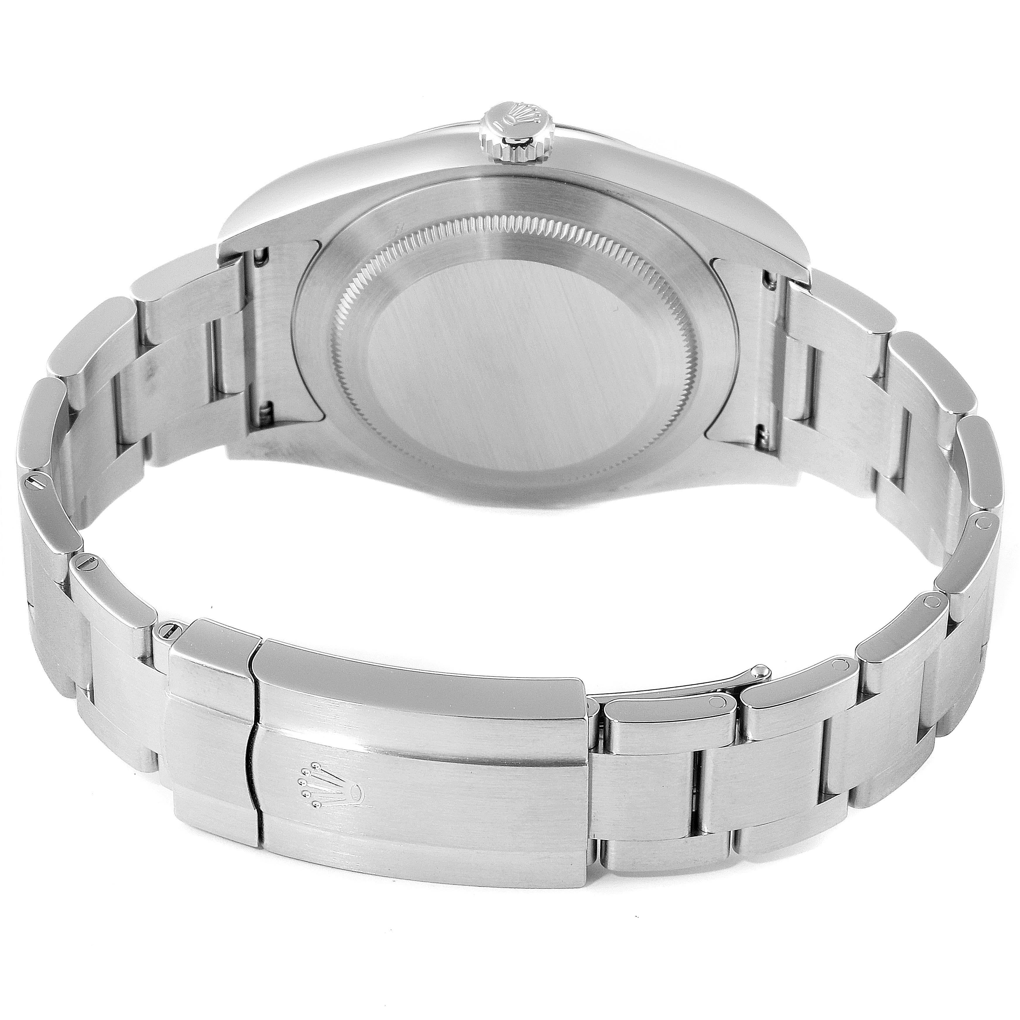 The image shows the back view of a Rolex Oyster Perpetual 114300 Men's Stainless Steel Blue Dial 114300 Men's Stainless Steel Blue Dial watch, highlighting the case back and bracelet.