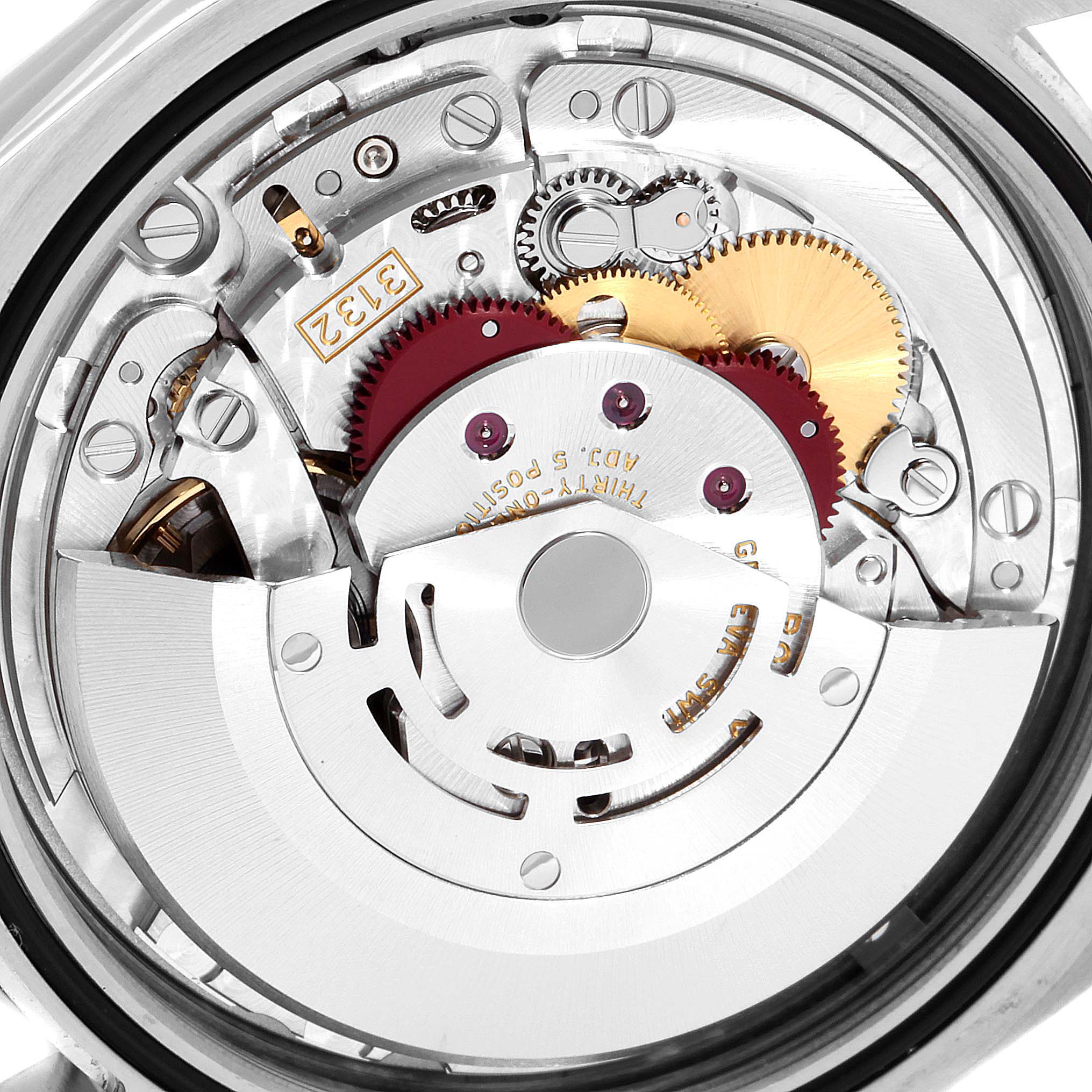 This image shows the inner mechanical movement of the Rolex Oyster Perpetual 114300 Men's Stainless Steel Blue Dial 114300 Men's Stainless Steel Blue Dial watch, highlighting the gears and rotor.