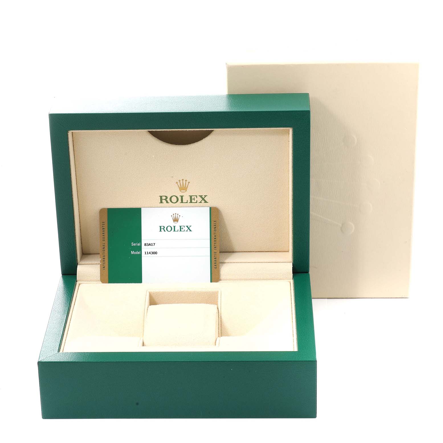 This image shows an empty Rolex Oyster Perpetual 114300 Men's Stainless Steel Blue Dial 114300 Men's Stainless Steel Blue Dial watch box, displaying the model and serial card inside.