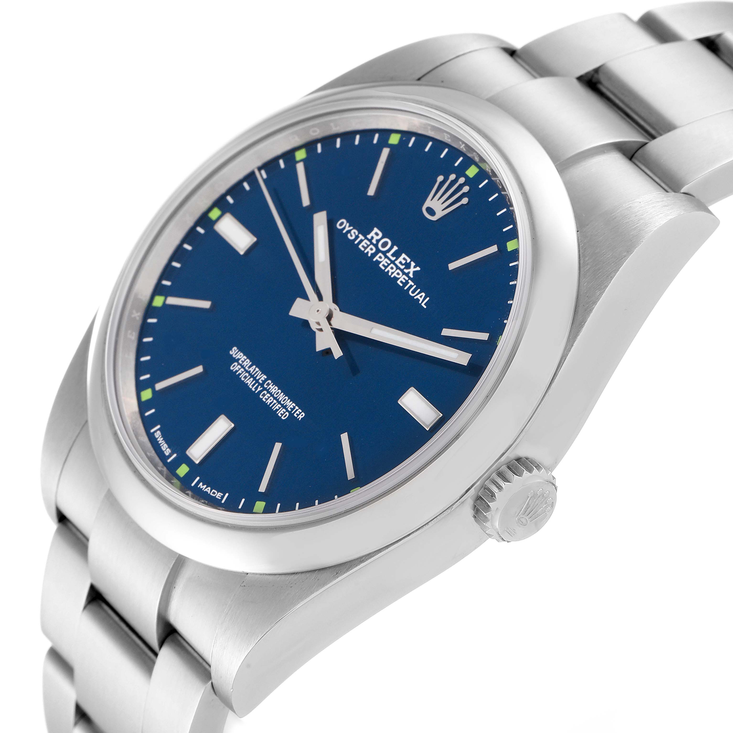 This image shows a side angle of a Rolex Oyster Perpetual 114300 Men's Stainless Steel Blue Dial 114300 Men's Stainless Steel Blue Dial watch, highlighting the blue dial, crown, and stainless steel bracelet.