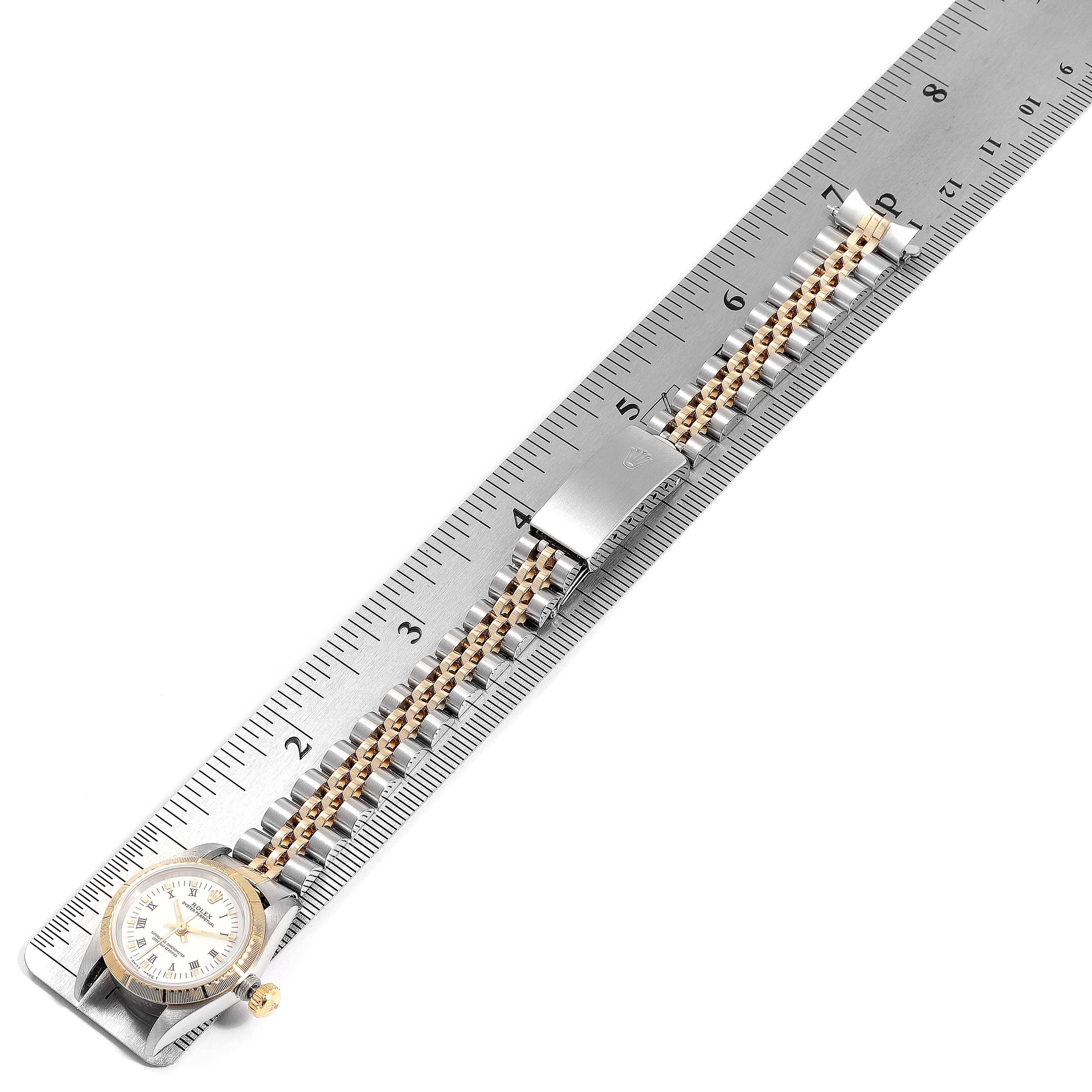 The Rolex Datejust 67243 Women's Steel and Gold (two tone) White Dial 67243 Women's Steel and Gold (two tone) White Dial watch is shown flat on its back with the face, bracelet, and clasp visible, measured against a ruler.