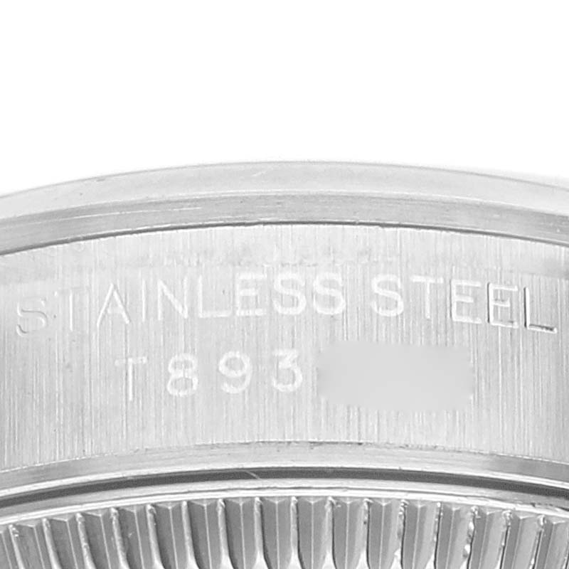 This image shows a close-up of the back case of a Rolex Oyster Perpetual 67180 Women's Stainless Steel Pink Dial 67180 Women's Stainless Steel Pink Dial watch, highlighting the stainless steel engraving.
