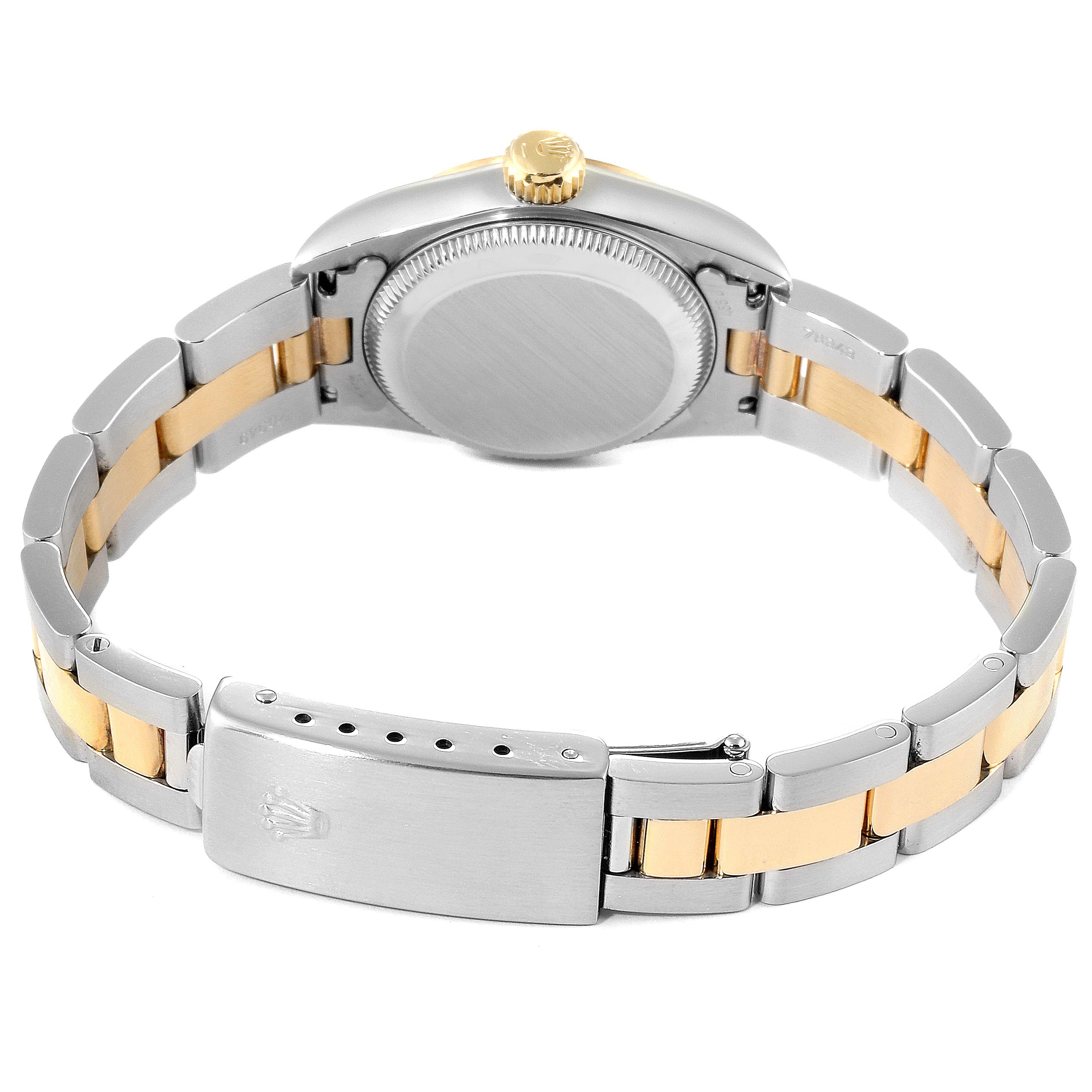 The image shows the back view of a Rolex Datejust 67183 Women
s Steel and Gold (two tone) Grey Dial 67183 Women
s Steel and Gold (two tone) Grey Dial watch, highlighting its clasp, bracelet, and case back.