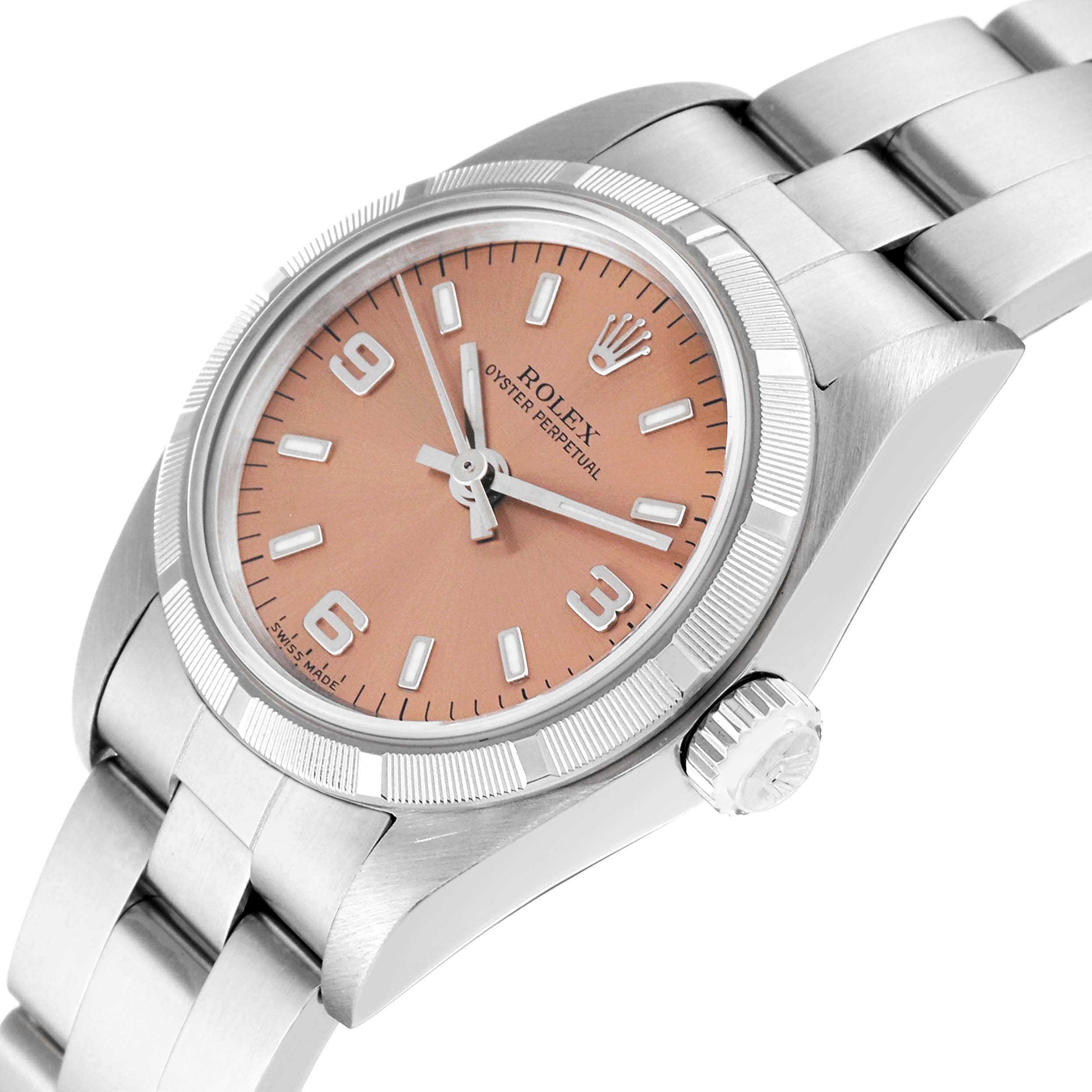 The image shows a close-up angle of the Rolex Oyster Perpetual 76030 Women's Stainless Steel Pink Dial 76030 Women's Stainless Steel Pink Dial watch, highlighting the dial, bezel, and part of the bracelet.