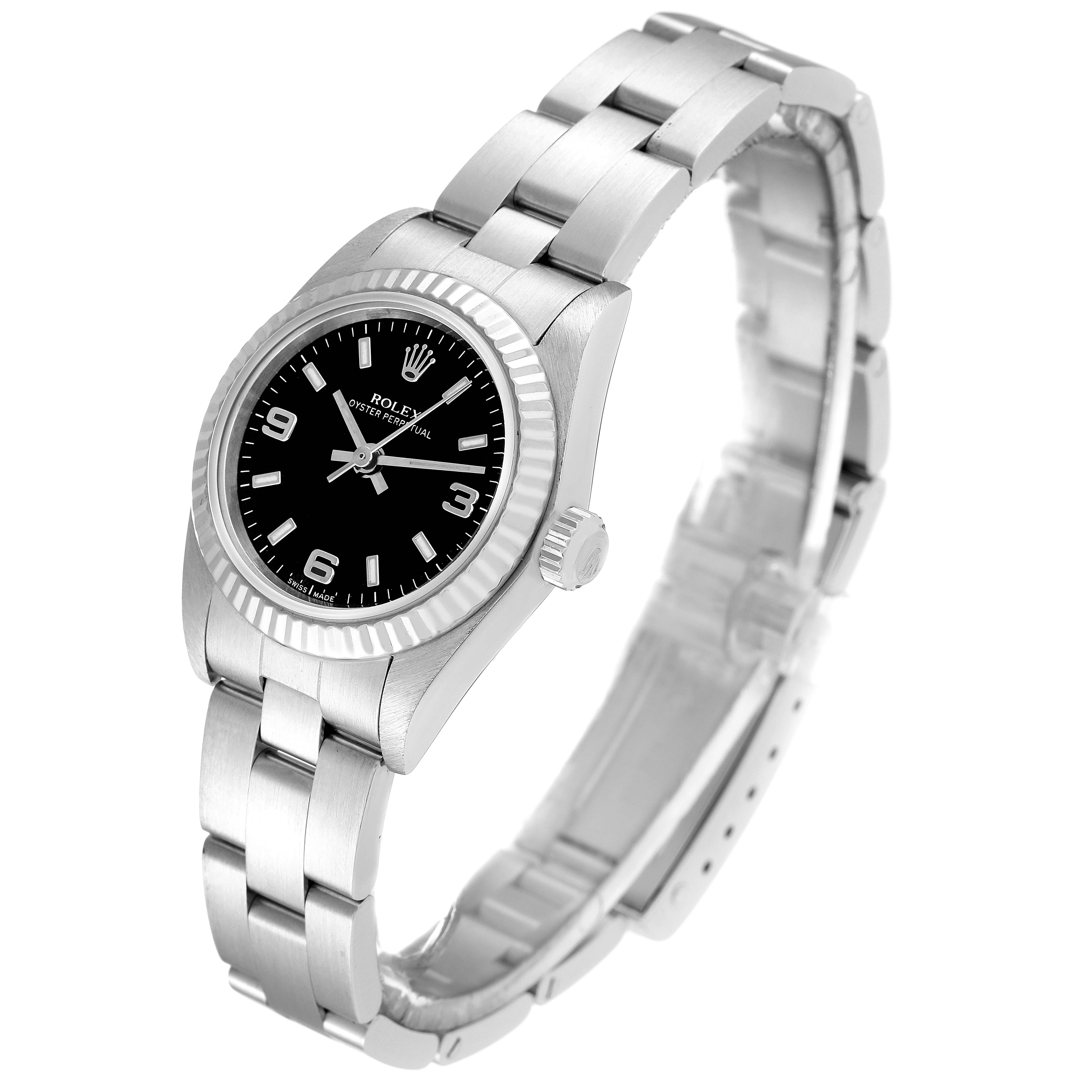 The image shows a Rolex Oyster Perpetual 76094 Women's Stainless Steel Black Dial 76094 Women's Stainless Steel Black Dial watch at an angled view, displaying the face, bezel, crown, and bracelet.