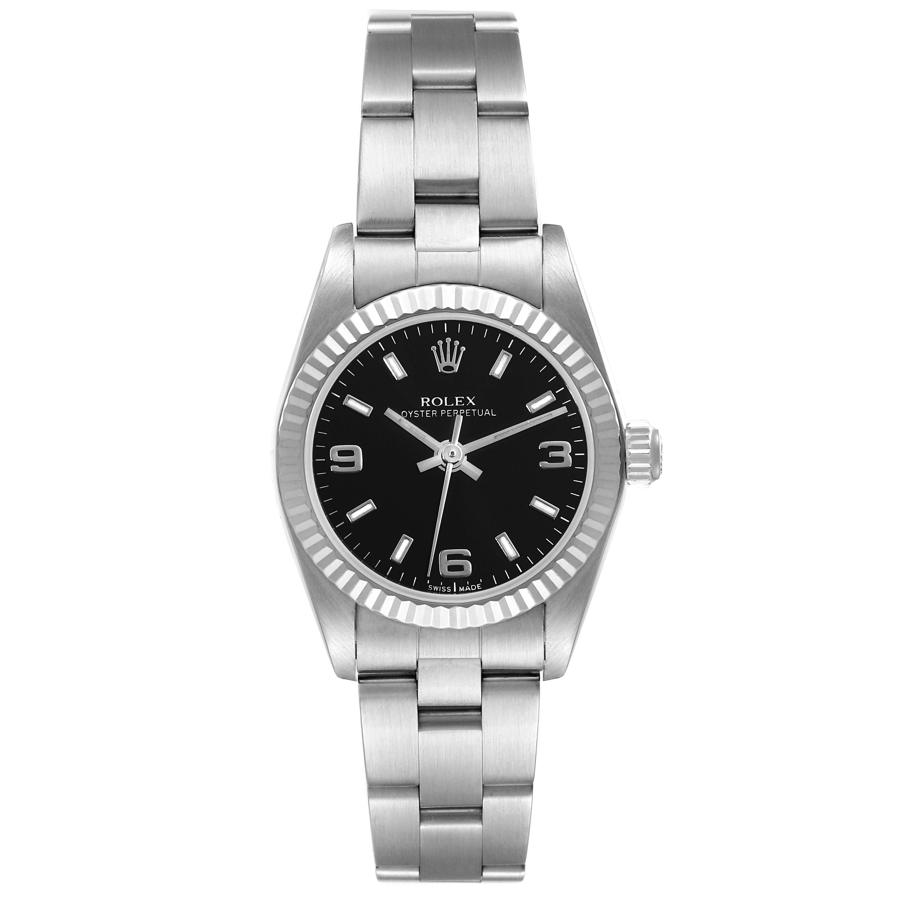 The Rolex Oyster Perpetual 76094 Women's Stainless Steel Black Dial 76094 Women's Stainless Steel Black Dial watch is shown from the front, displaying its black dial, stainless steel case, bracelet, and fluted bezel.