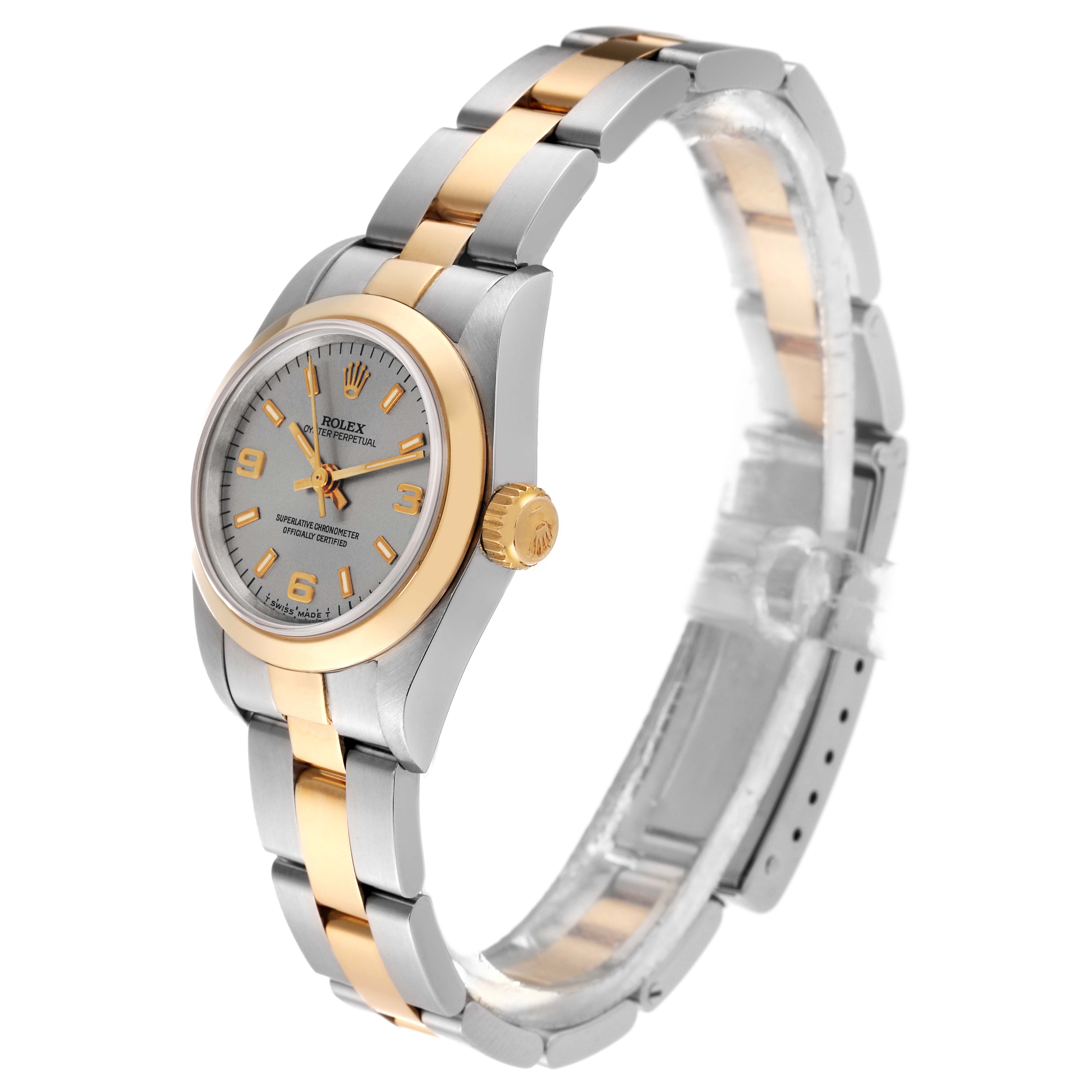 The Rolex Oyster Perpetual 67183 Women's Steel and Gold (two tone) Silver Dial 67183 Women's Steel and Gold (two tone) Silver Dial watch is shown at a three-quarter angle, highlighting the face, bezel, and two-tone bracelet.