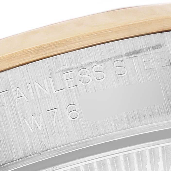 The image shows a close-up of the case side of a Rolex Oyster Perpetual 67183 Women's Steel and Gold (two tone) Silver Dial 67183 Women's Steel and Gold (two tone) Silver Dial, highlighting the stainless steel material and engravings.
