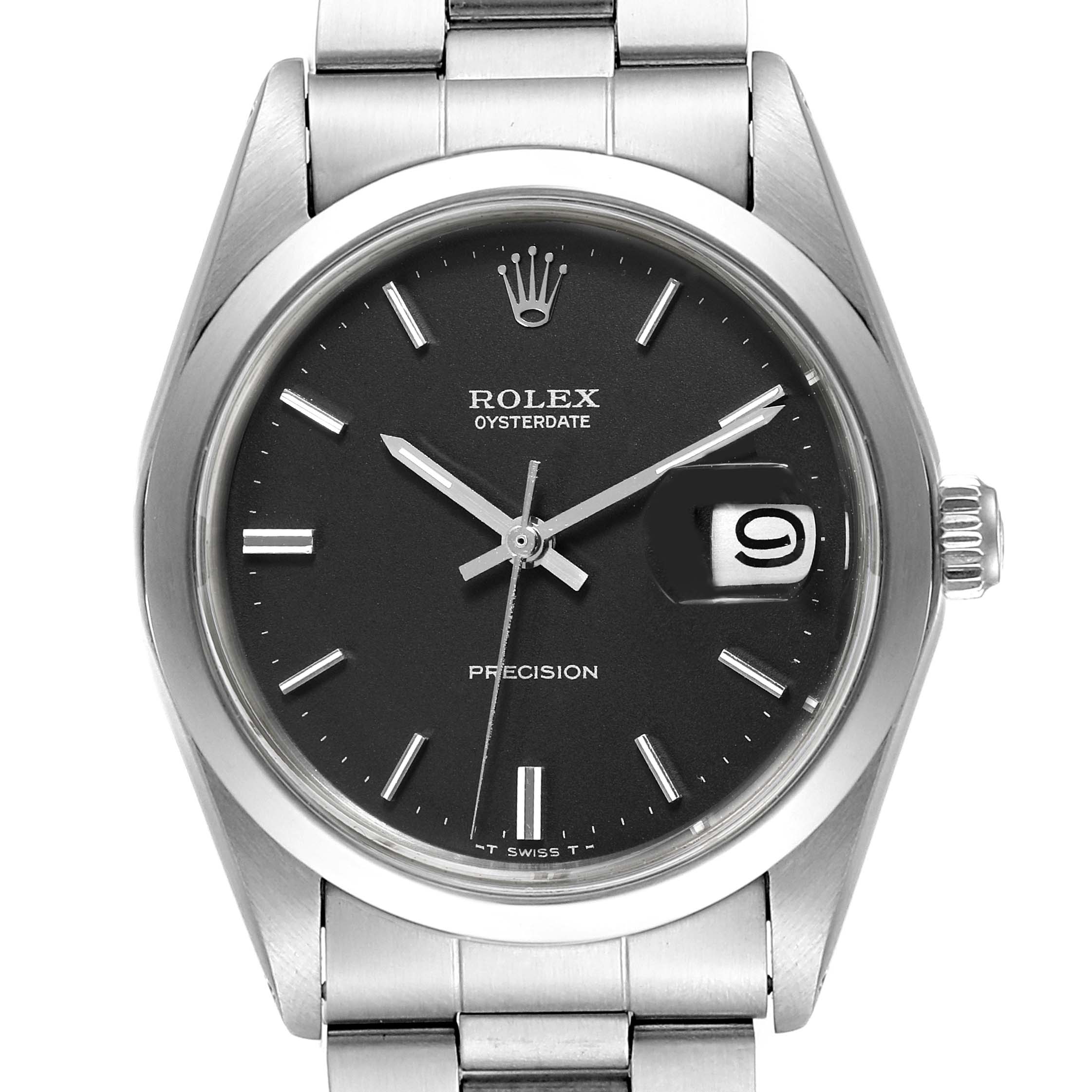 The image shows a Rolex Vintage Collection 6694 Men's Stainless Steel Black Dial 6694 Men's Stainless Steel Black Dial watch featuring a black dial, silver hour markers, a date window, and a stainless steel bracelet.