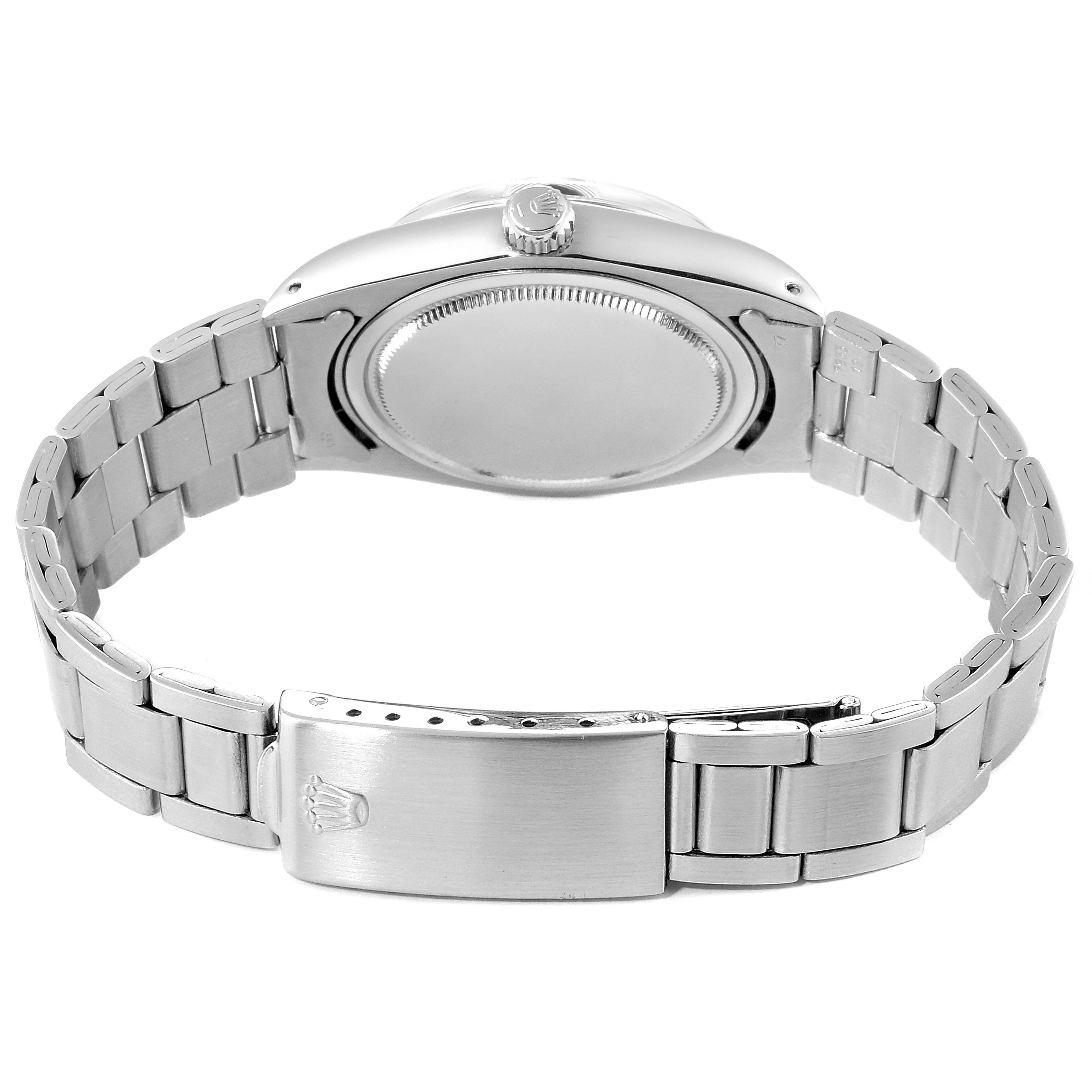 The image shows the back and clasp of a Rolex Vintage Collection 6694 Men's Stainless Steel Black Dial 6694 Men's Stainless Steel Black Dial watch, highlighting the metal bracelet and closed case back.