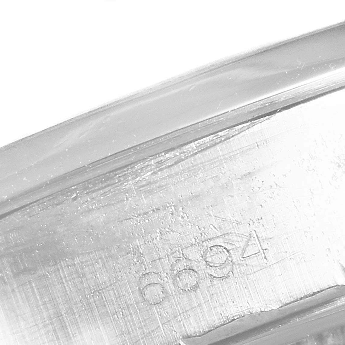 The image shows a close-up view of a Vintage Collection Rolex watch case, highlighting the engraved model number "6694."