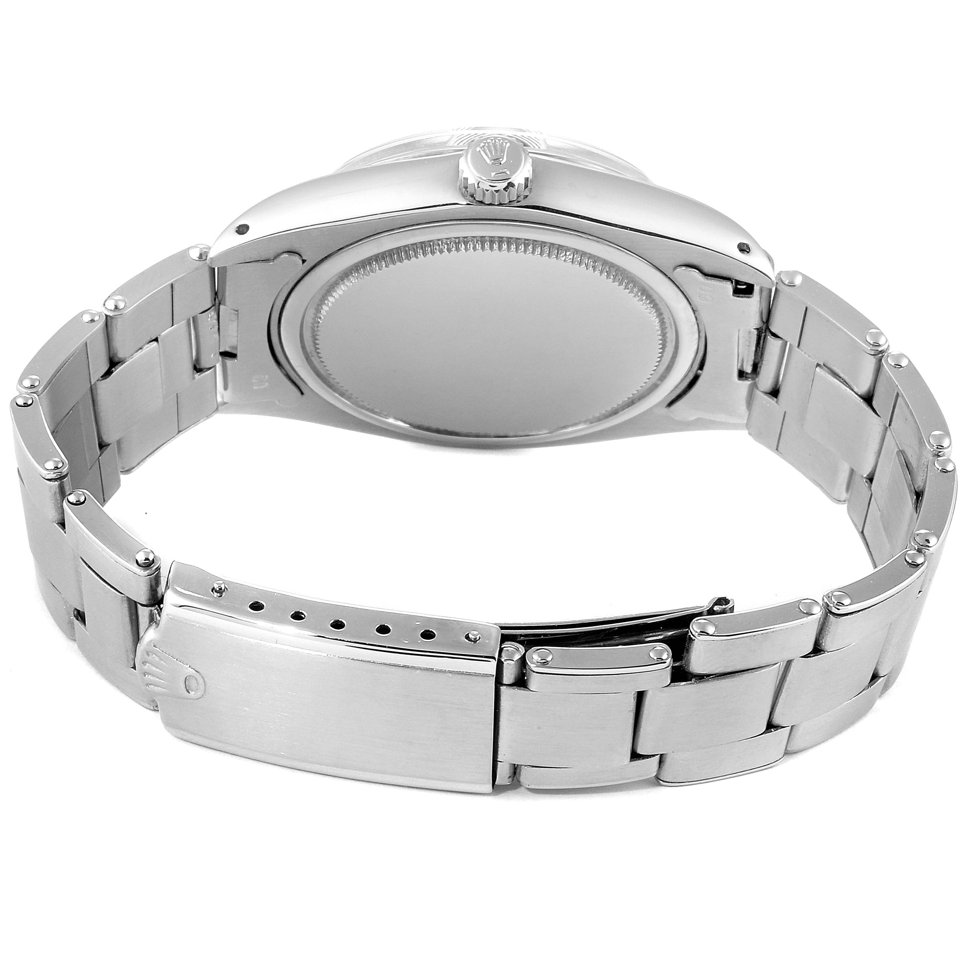 The image shows the back view of a Rolex Vintage Collection 6694 Men's Stainless Steel Black Dial 6694 Men's Stainless Steel Black Dial watch, highlighting the case back and metal bracelet with the clasp.